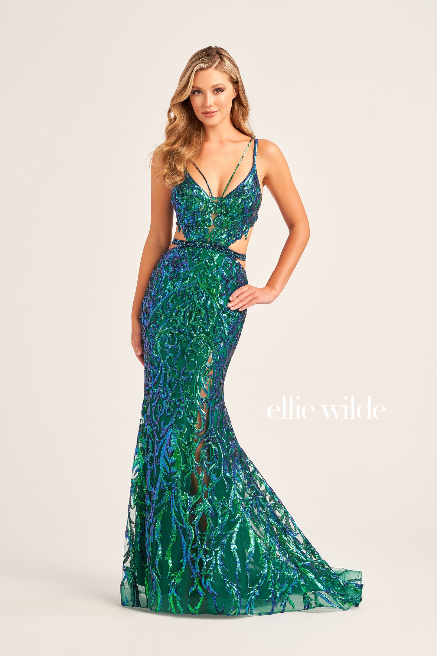 Make a statement in Ellie Wilde's EW35007 Sheer Sequin Cut Out Prom Dress. With its V-Neck Sweetheart Neckline, open back, side waist cut out, and sequin-beaded tulle fabric, this trumpet silhouette gown is an eye-catching formal look. Perfect for any special occasion.  COLOR: ORANGE, EMERALD, IRIS SIZE: 00 - 16