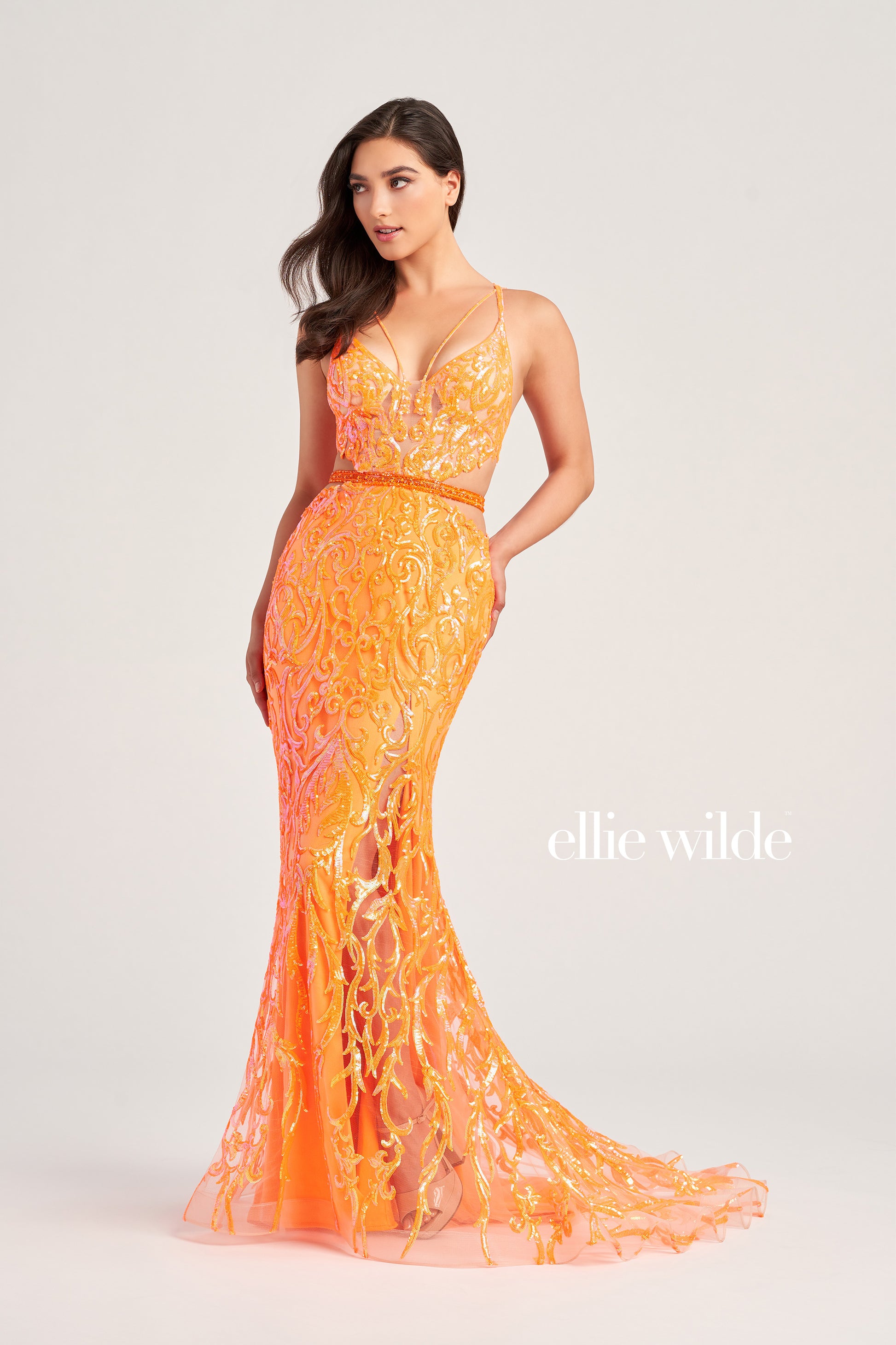 Make a statement in Ellie Wilde's EW35007 Sheer Sequin Cut Out Prom Dress. With its V-Neck Sweetheart Neckline, open back, side waist cut out, and sequin-beaded tulle fabric, this trumpet silhouette gown is an eye-catching formal look. Perfect for any special occasion.  COLOR: ORANGE, EMERALD, IRIS SIZE: 00 - 16