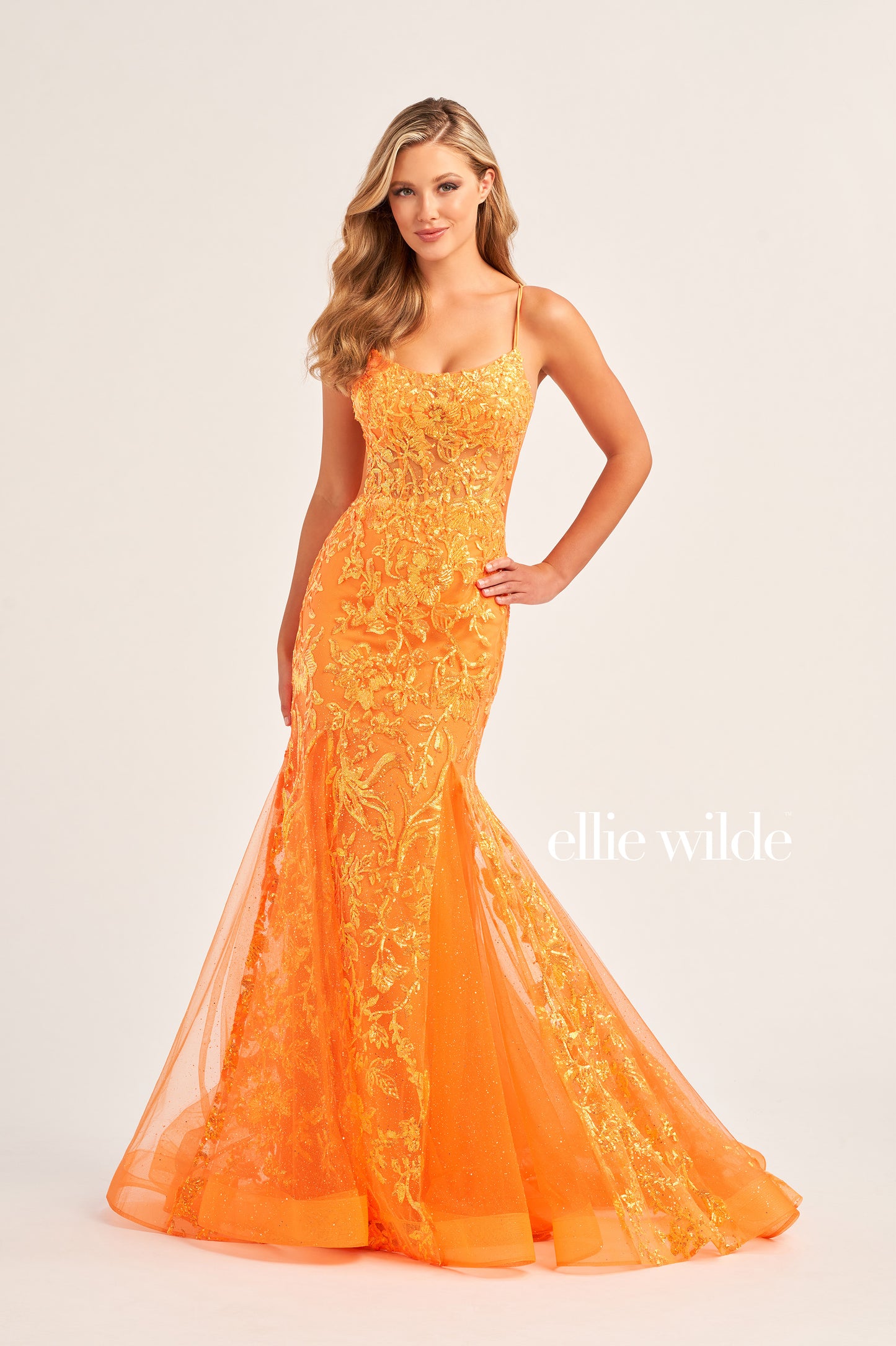 Show up in style with the Ellie Wilde EW35008 Long Sequin Shimmer Mermaid Prom Dress. Made with Glitter Sequin Tulle, this elegant gown has a Scoop Neckline, Sleeveless sleeves, Lace-Up back, and a Natural Waistline. Experience maximum comfort with the Side Waist Mesh Inset and Mermaid silhouette. Show off your curves in this figure-hugging dress!  COLOR: ORANGE, MAGENTA, ULTRA VIOLET, PERIWINKLE/OPAL SIZE: 00 - 20