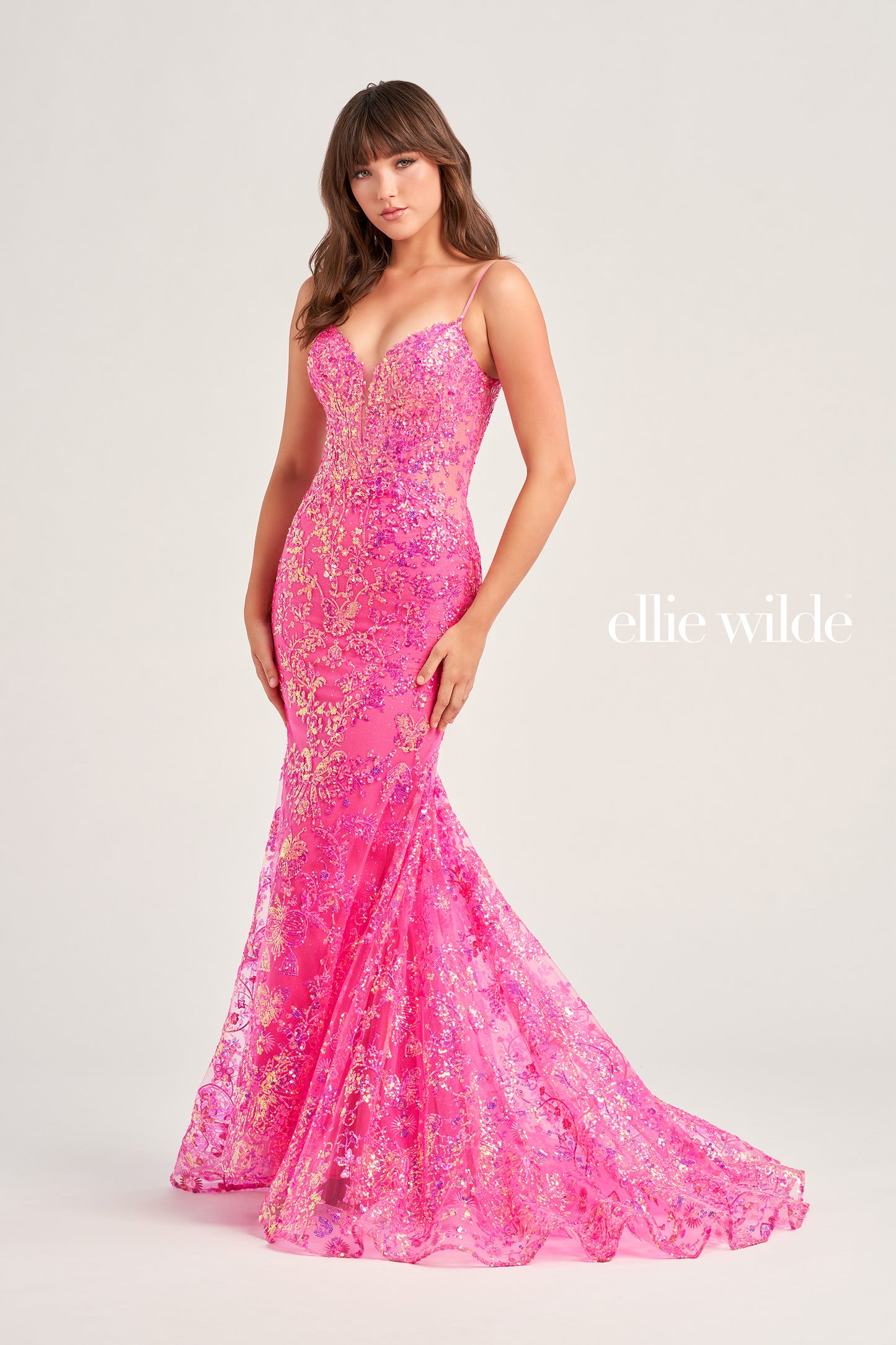 Make a stunning appearance at your next formal event in this Ellie Wilde EW35013 Long Fitted Sequin Mermaid Prom Dress. Crafted from an exquisite combination of Embroidered Tulle, Glitter Tulle, and Sequins, this beautiful dress includes a plunging Sweetheart neckline, a corset bodice with a lace-up back, and a trumpet silhouette for the perfect fit. The Natural waistline and Sleeveless design complete the look.  COLOR: BLACK, MIDNIGHT, LIGHT BLUE, LILAC, HOT PINK SIZE: 00 - 20