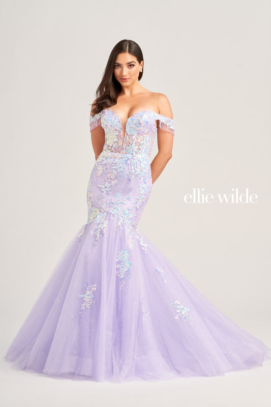 This stunning Ellie Wilde EW35219 Long Shimmer Sequin Mermaid Dress will make you stand out at any special occasion. Crafted with glitter tulle fabric and sequin appliqué, the eye-catching off the shoulder fringe adds a unique touch to the plunging sweetheart neckline and corset bodice. The luxurious lace-up back and natural waistline ensures the perfect fit.  COLOR: OCEAN BLUE, DARK PURPLE, LILAC SIZE: 00 - 16