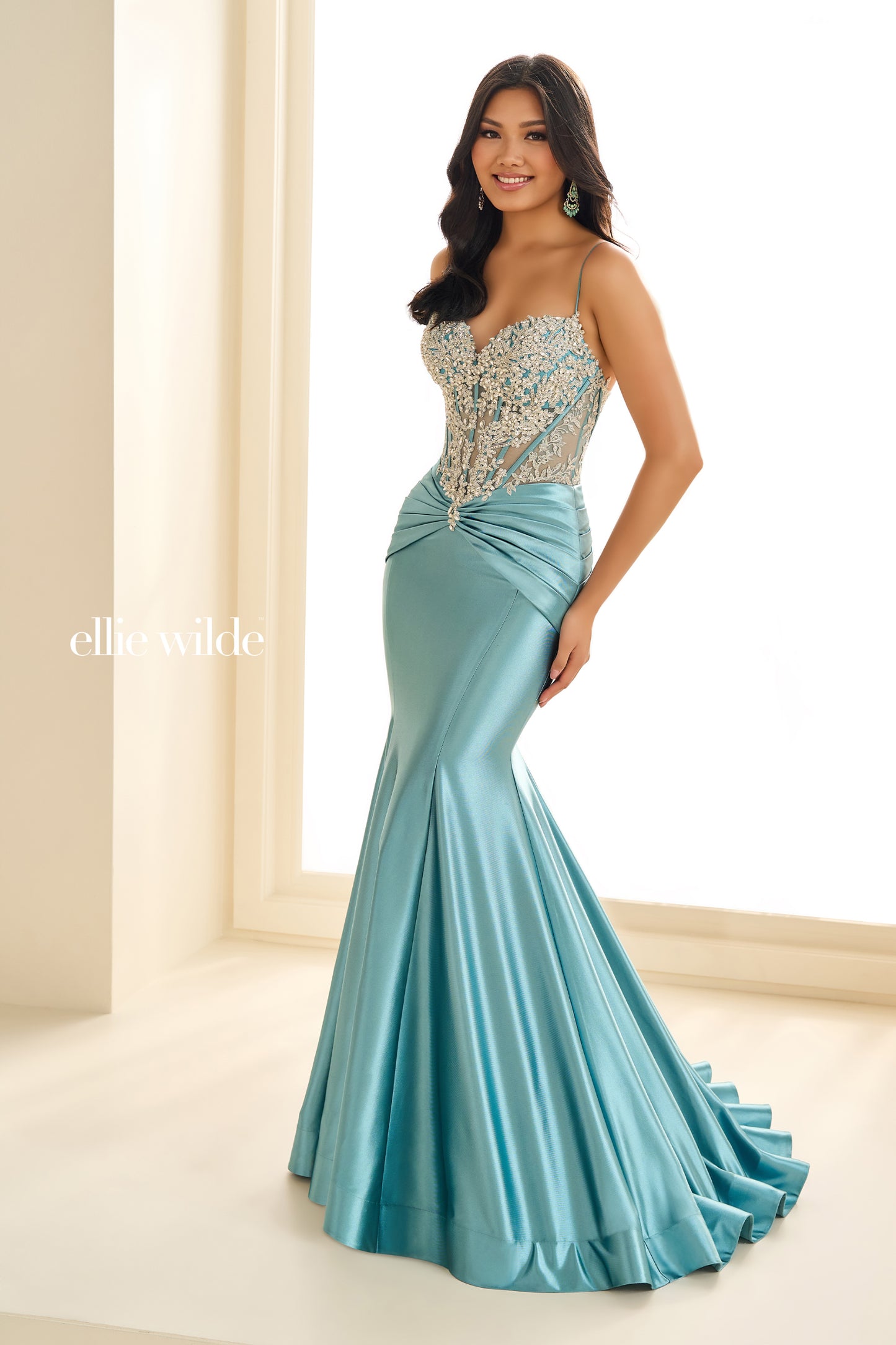 Introducing the elegant Ellie Wilde EW36004 Sheer Sequin Lace Mermaid Prom Dress, perfect for any formal evening event. Made with a ruched waistline, this dress accentuates your figure while providing a comfortable fit. The sheer sequin lace adds a touch of glamour, making you the center of attention.