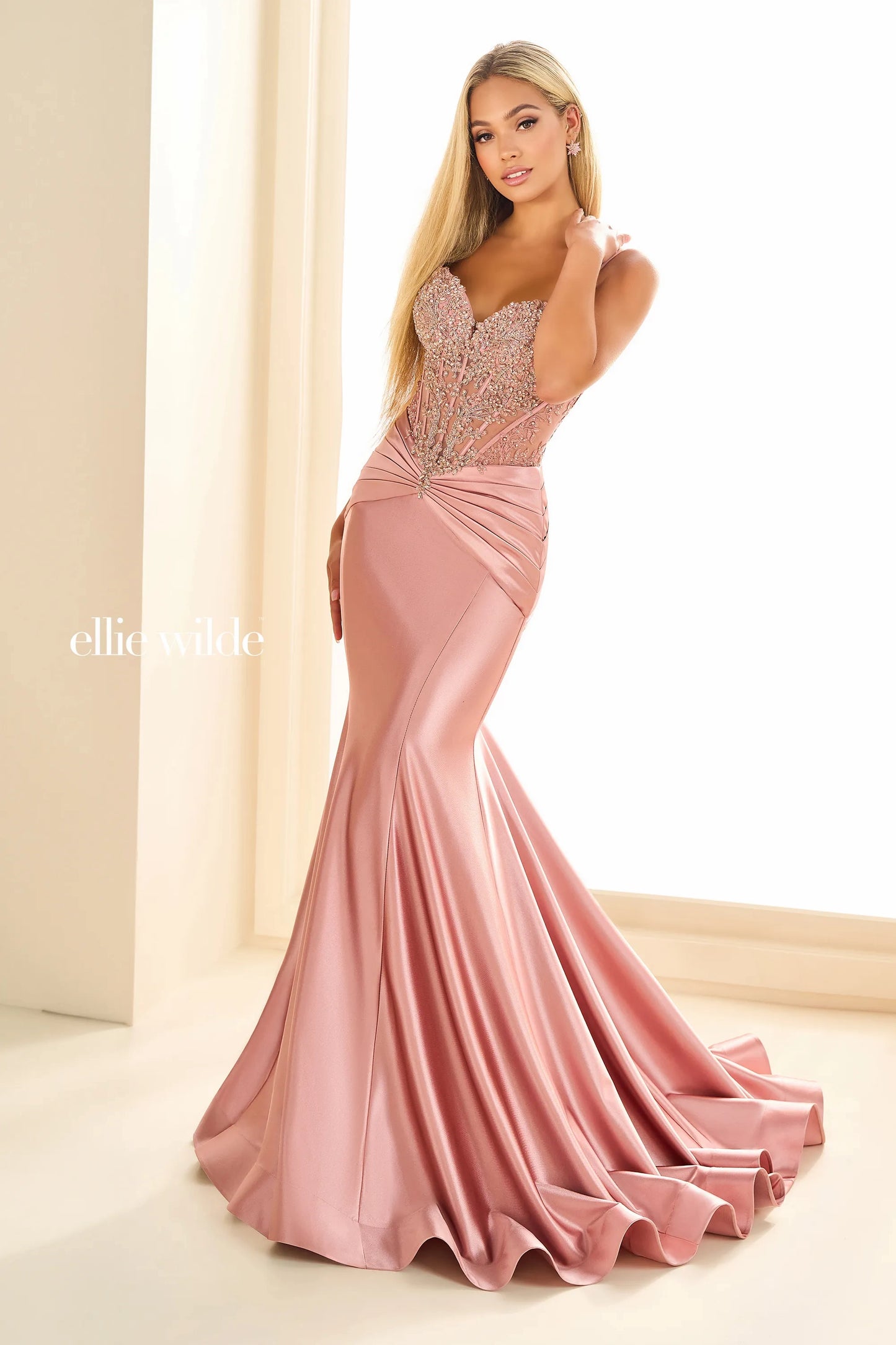 Introducing the elegant Ellie Wilde EW36004 Sheer Sequin Lace Mermaid Prom Dress, perfect for any formal evening event. Made with a ruched waistline, this dress accentuates your figure while providing a comfortable fit. The sheer sequin lace adds a touch of glamour, making you the center of attention.