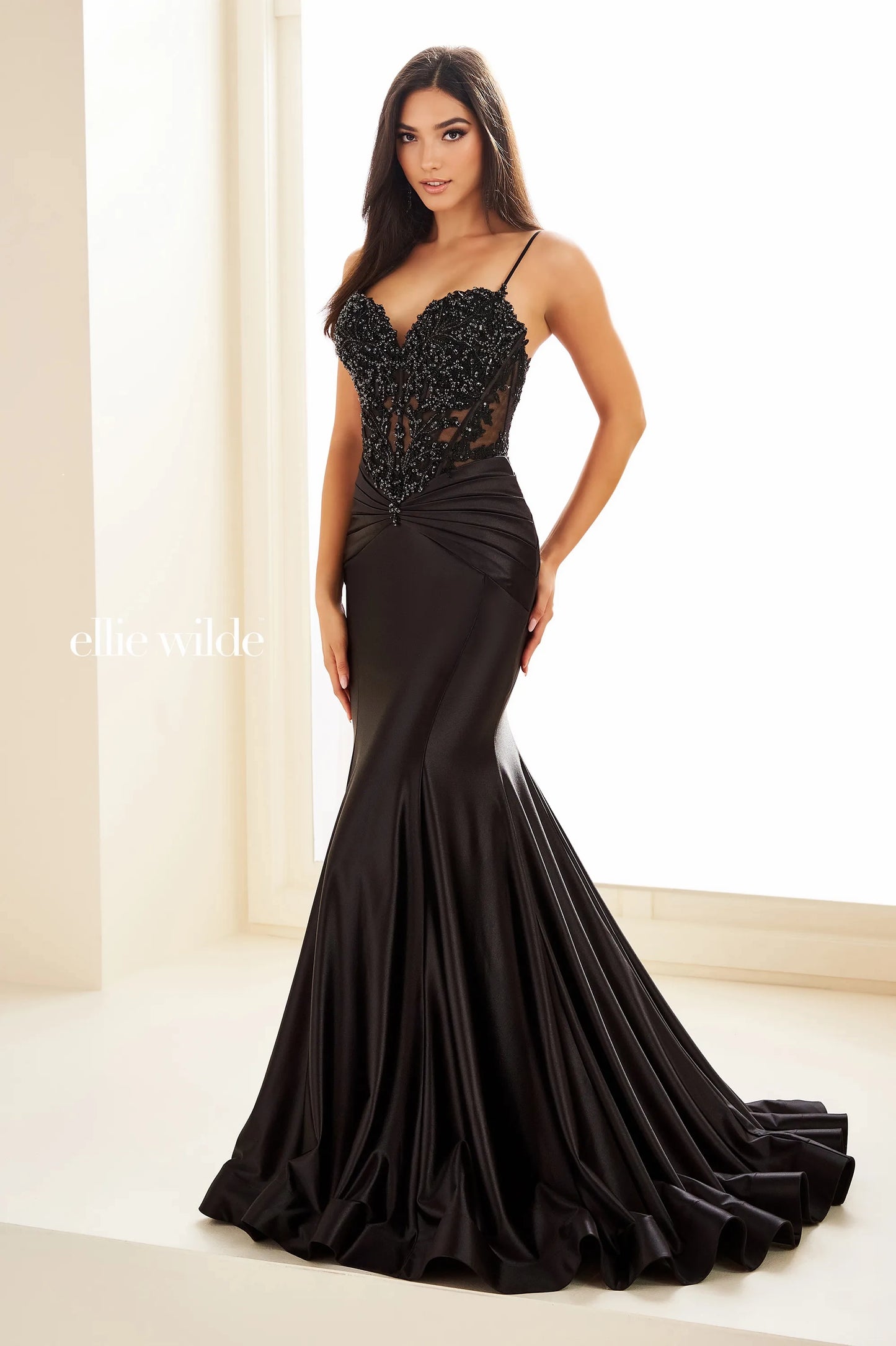 Introducing the elegant Ellie Wilde EW36004 Sheer Sequin Lace Mermaid Prom Dress, perfect for any formal evening event. Made with a ruched waistline, this dress accentuates your figure while providing a comfortable fit. The sheer sequin lace adds a touch of glamour, making you the center of attention.