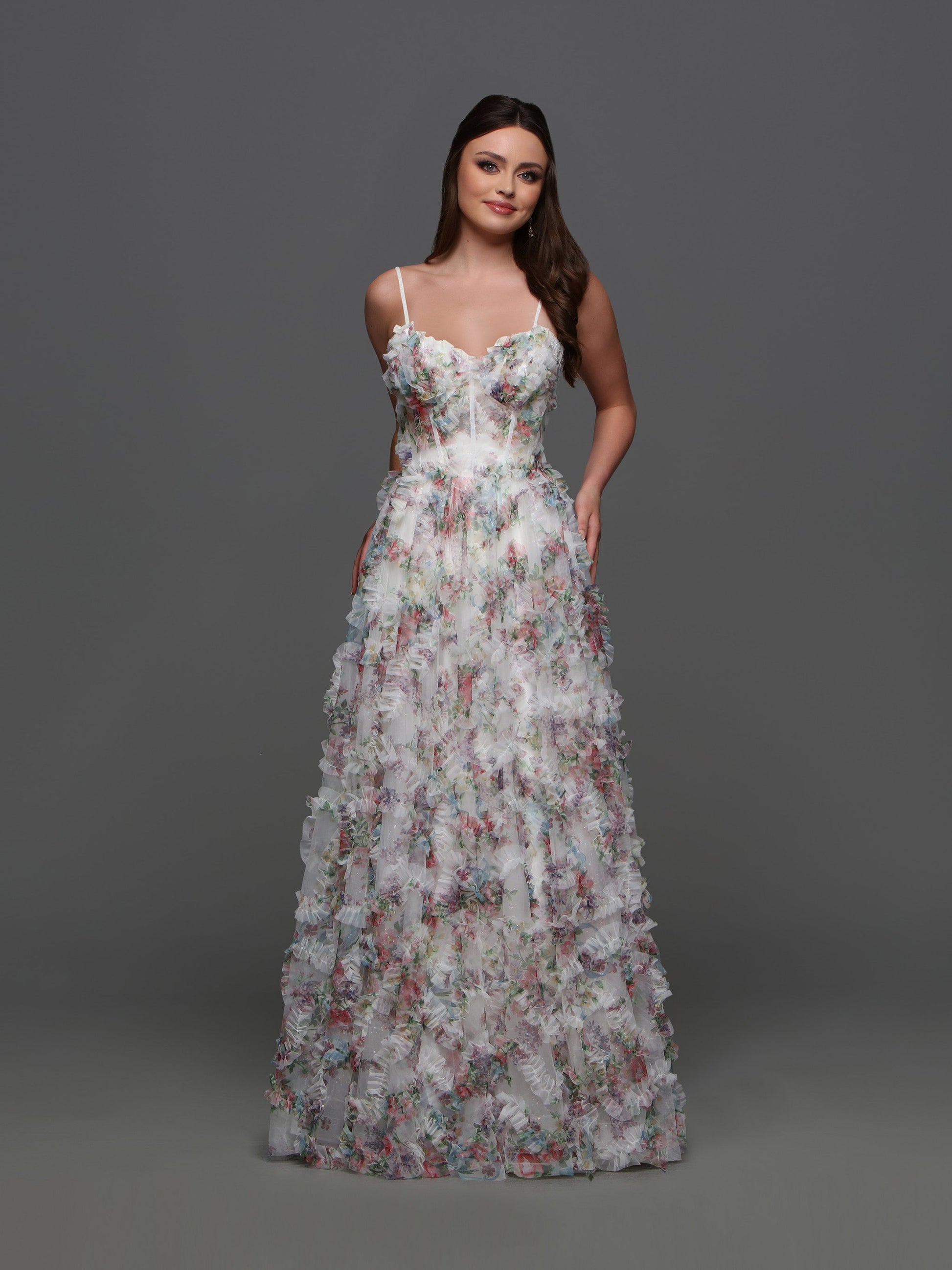 Experience elegance and grace with the Davinci F145 Floral Print Prom Dress. The stunning puff sleeves and A-line silhouette enhance your natural beauty while the sheer corset and shimmering pleats create a dreamy and ethereal look.