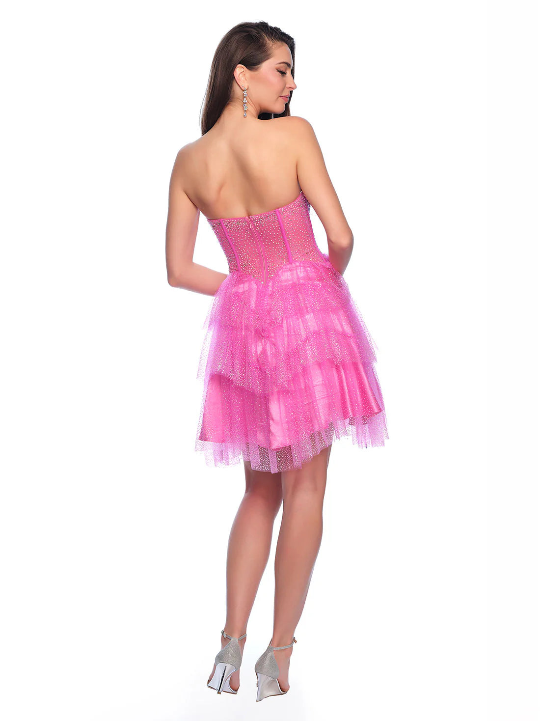 Get ready to sparkle in this Short Glitter Layer Sheer Corset Homecoming Dress by Dave &amp; Johnny. Designed with a flattering A Line cut, this cocktail gown is perfect for any special occasion. The glitter overlay adds a touch of glamour, while the sheer corset provides a sexy and unique detail. Channel your inner fashionista with this stunning dress.