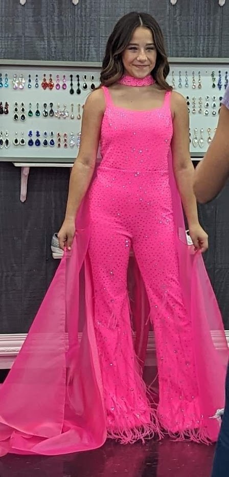 Ashley Lauren Kids 8210 Long Girls Pageant Jumpsuit with Crystal embellishements and a scoop neckline. Feather Embellished flared Bell Bottoms with a choker embellished with crystals and organza Cape.  Sizes: 4-16  Colors: Aqua, Fuchsia