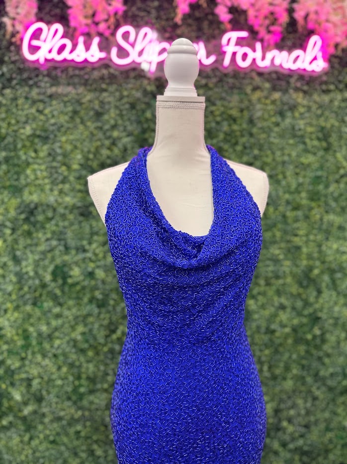 Johnathan Kayne 2728 is a size 4 cowl neck formal gown crafted with Custom Liquid Beading. The halter neck closure makes for a beautiful and stylish silhouette with a royal finish. Perfect for your next event!   ** One of a kind Custom  Size: 4  Color: Royal