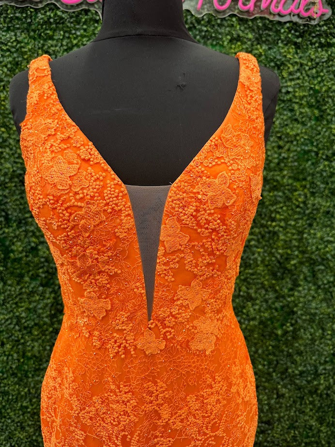 Look stunning in this Johnathan Kayne 31575 Size 4 Orange Lace V Neck Fitted Formal Prom Dress. Crafted from shimmering lace, this fitted design is sure to draw eyes. Show off your best features in this show-stopping dress.  Size: 4  Color: Orange