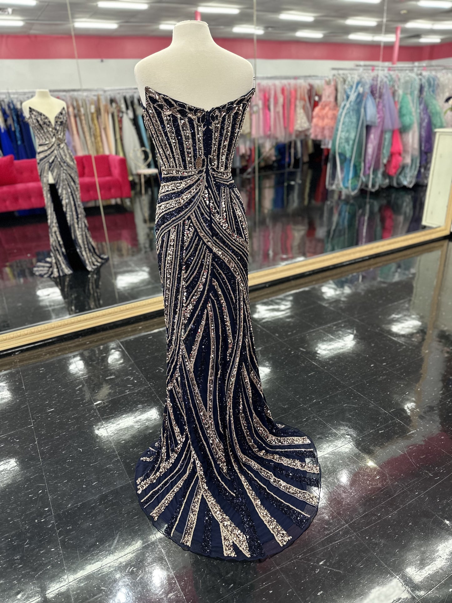 Ashley Lauren 11236 Long Fitted V Neck Slit Beaded Sequin Prom Dress Pageant Gown This strapless gown is sure to turn heads. The sweetheart neckline is complete with a modern floral sequin motif that continues down the bustier and skirt. The skirt is complete with a left leg slit.