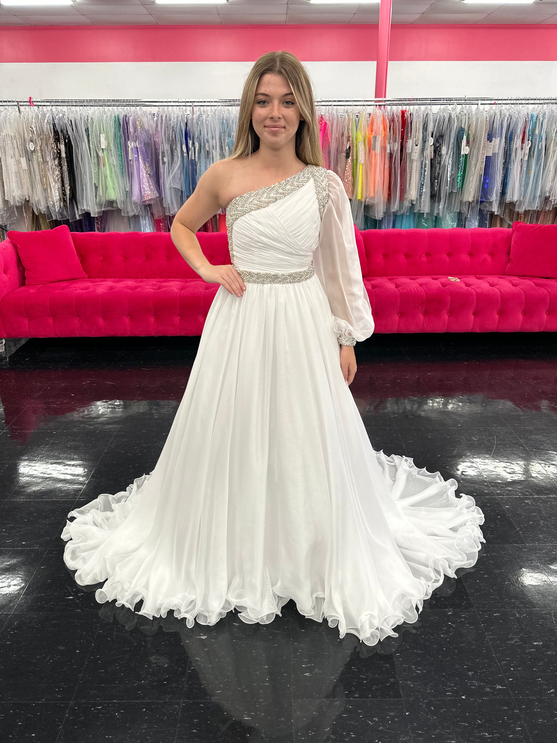 Be the epitome of grace and elegance in the Samantha Blake 1014 one shoulder Long Sleeve Pageant Dress. Made with delicate chiffon and a stunning crystal embellished bodice, this dress features a one-shoulder design and long sleeves for a sophisticated look. Perfect for any pageant or formal event.