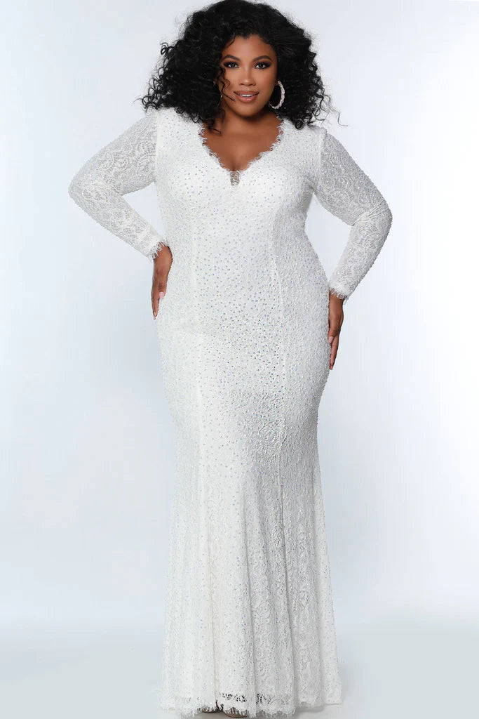 Johnathan Kayne for Sydney's Closet JK2104 Long Sleeve Mermaid Tone On Tone Stones Stretch Lace V-Neck Plus Size Formal Gown. Look stunning in this Johnathan Kayne for Sydney's Closet JK2104 Plus Size Formal Gown. This V-neck gown features long sleeves, tone-on-tone stones and stretch lace for a flattering fit. A glamorous mermaid silhouette is sure to make you the star of the show.