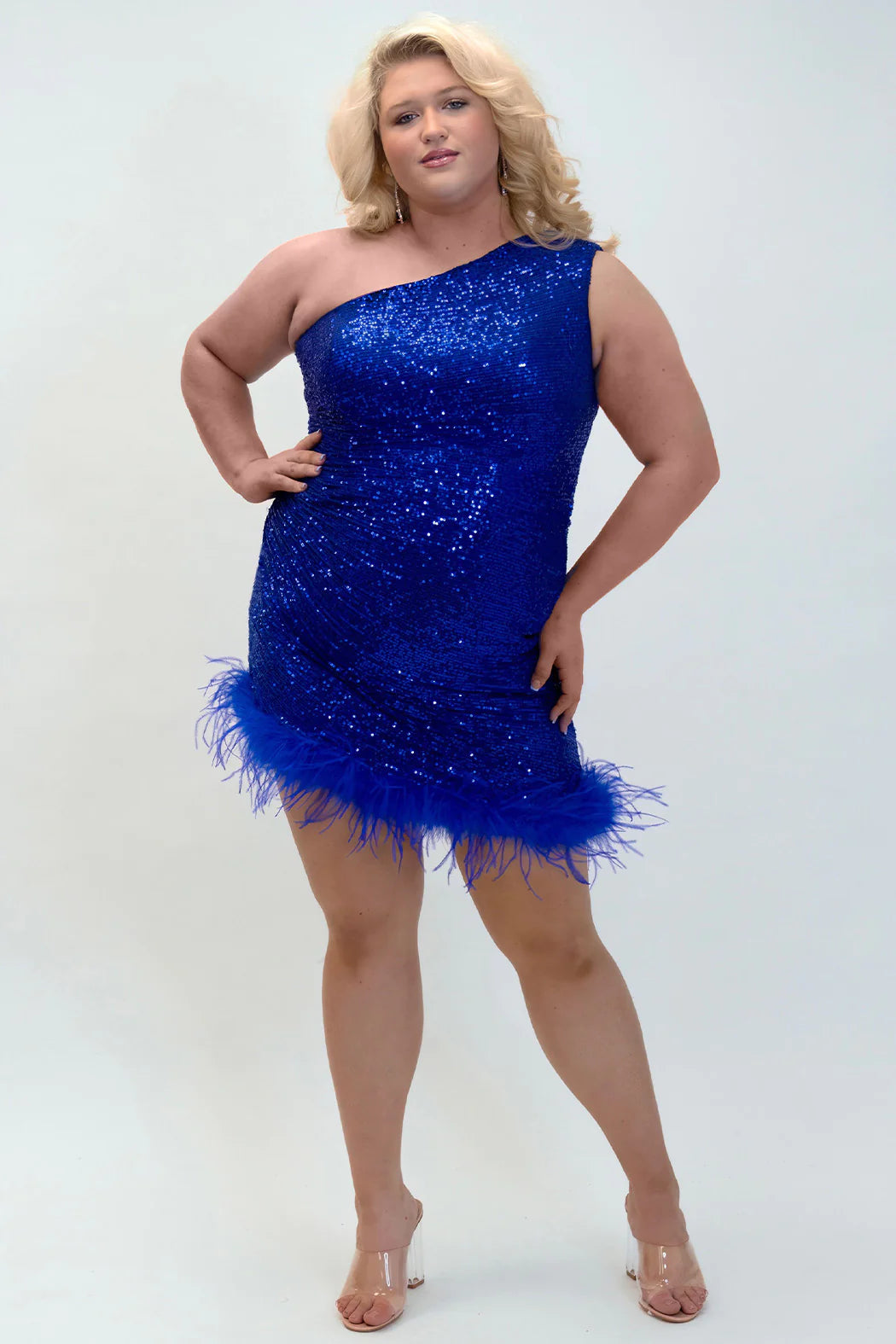 This Sydneys Closest JK2401 Cocktail Dress is perfect for any special occasion. It features a one-shoulder, sequin design and is made from luxurious feather fabric. This plus-size dress is perfect for making a statement at any formal event. Ignite a Feather Frenzy in this sizzling dress! It's a guaranteed showstopper with a fitted silhouette