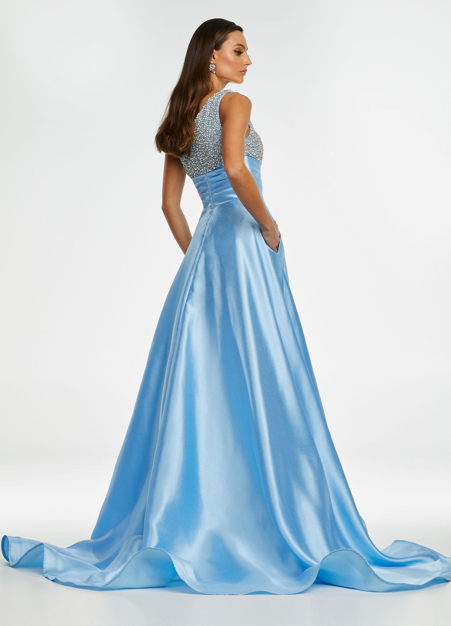 Ashley Lauren 11149 One Shoulder Ball Gown Prom Dress with Embellished Bodice  Sparkle in this one shoulder taffeta ball gown. The elegantly encrusted bustier is embellished with pearls and crystals that give way to wrap waistline. Did we mention is has pockets?!  One Shoulder Beaded Bustier Shimmer Taffeta Train Colors:  Sky, Aqua, Pink, White Sizes:  0-16