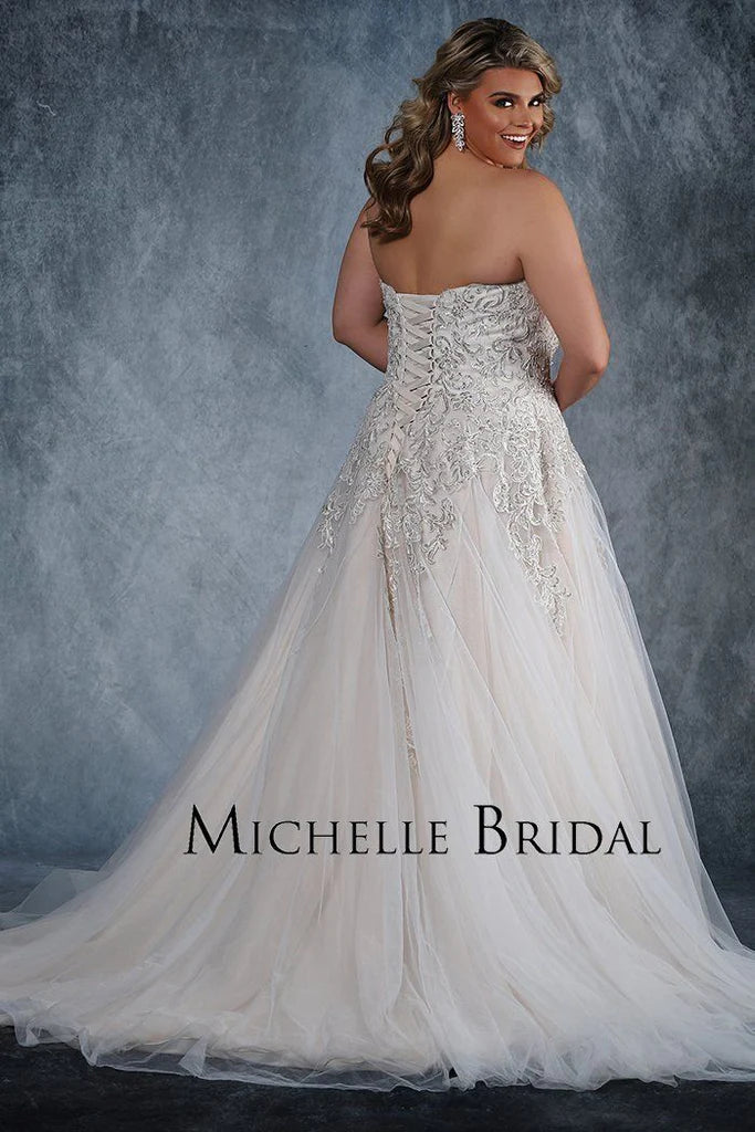 Michelle Bridal For Sydney's Closet MB1819 A-Line Sweetheart Neckline Strapless Lace Up Back Heavily Beaded Bodice Plus Size "Vanessa" Bridal Gown. Impress your guests on your special day with the luxurious Vanessa bridal gown from Michelle Bridal for Sydney's Closet. Crafted with a sweetheart neckline and a heavily beaded bodice, this strapless A-line gown also features a stylish lace-up back. Make a lasting impression in this plus size dress.