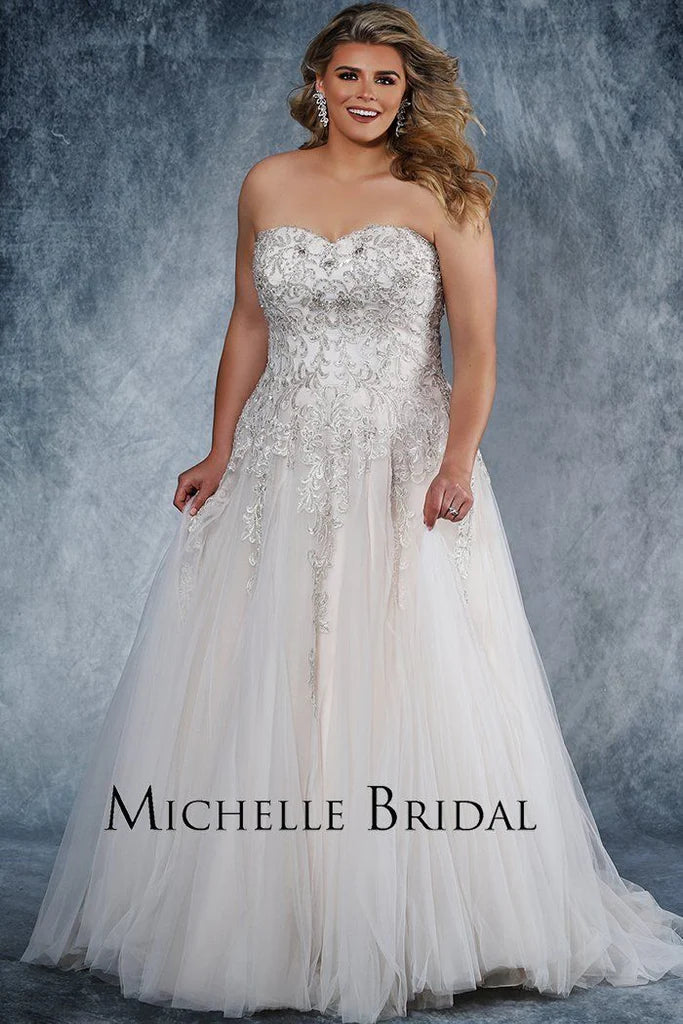 Michelle Bridal For Sydney's Closet MB1819 A-Line Sweetheart Neckline Strapless Lace Up Back Heavily Beaded Bodice Plus Size "Vanessa" Bridal Gown. Impress your guests on your special day with the luxurious Vanessa bridal gown from Michelle Bridal for Sydney's Closet. Crafted with a sweetheart neckline and a heavily beaded bodice, this strapless A-line gown also features a stylish lace-up back. Make a lasting impression in this plus size dress.