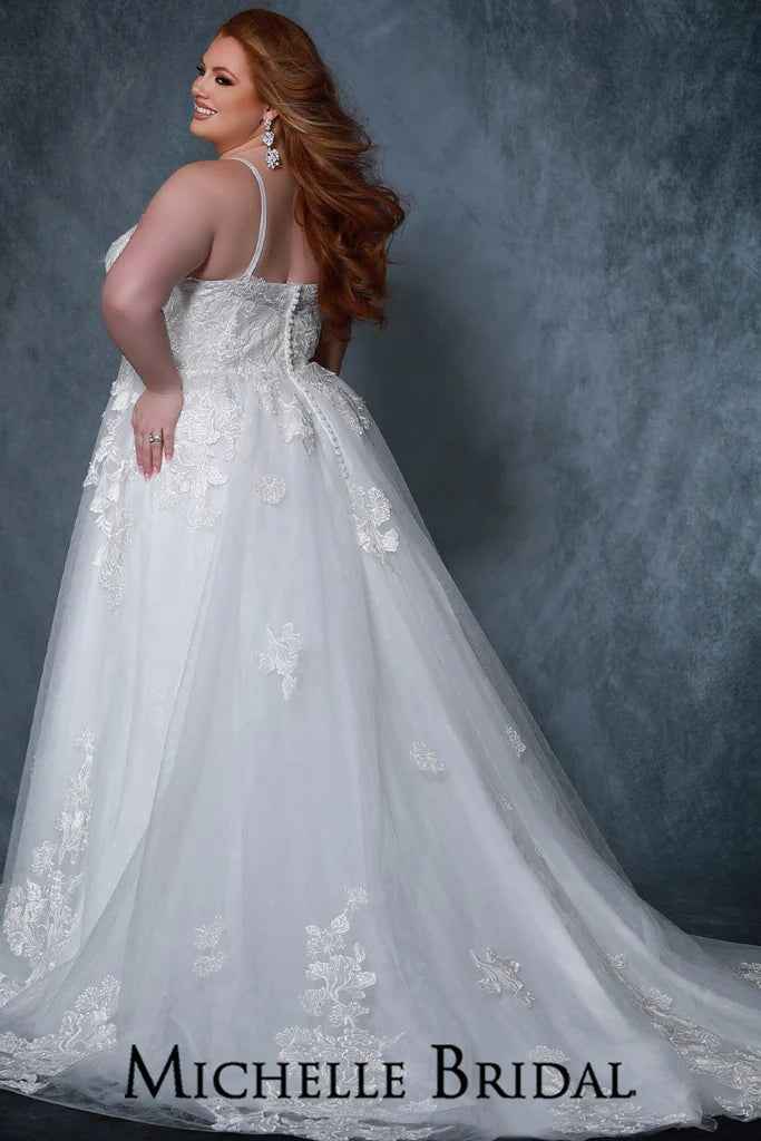 Michelle Bridal For Sydney's Closet MB2205 A-Line Silhouette Sweetheart Neckline Net Embossed With Floral Pattern Contemporary Dramatic Floral Appliques With Clear Sequins Plus Size "Fleur" Bridal Gown. Look your best on your special day with the Michelle Bridal For Sydney's Closet MB2205 Plus Size "Fleur" Bridal Gown. Featuring an A-Line silhouette with a sweetheart neckline, this net embossed gown is adorned with contemporary dramatic floral appliques and clear sequins for a truly memorable look.