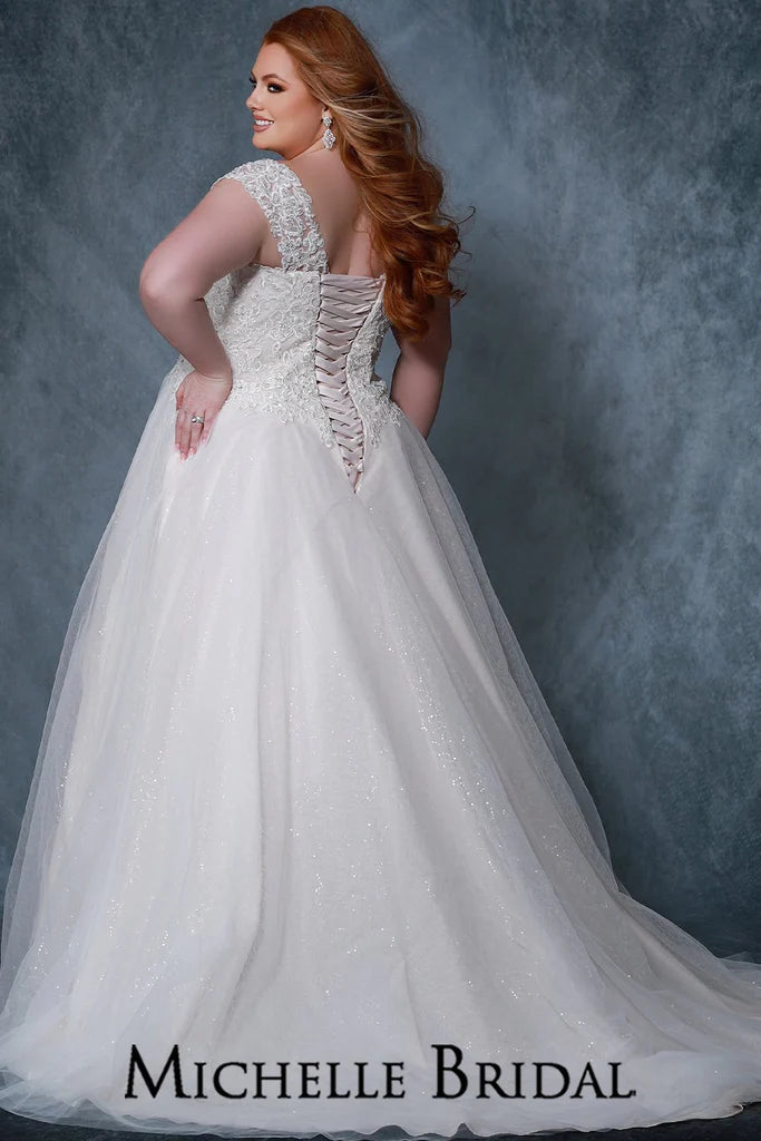 Michelle Bridal For Sydney's Closet MB2211 Ballgown Silhouette Sweetheart Neckline Strapless Optional Off The Shoulder Straps Modified Empire Lace Up Back Plus Size "Valerie" Bridal Gown. Make your special day perfect with this stunning plus size "Valerie" bridal gown from Michelle Bridal for Sydney's Closet. This beautiful gown features a ballgown silhouette, sweetheart neckline, strapless design, and optional off-the-shoulder straps. It offers a modified empire waist and a lace up back for a perfect fit.