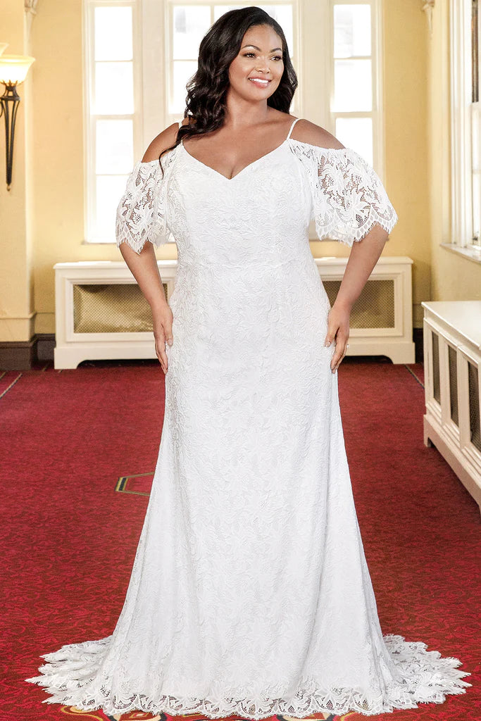 Michelle Bridal For Sydney's Closet MB2306 Slim Sheath Boho Lace With Eyelash Trim Bridal Tulle V-Neck Plus Size "Kahlo" Bridal Gown Fall in love with the romantic lace details of this Michelle Bridal For Sydney's Closet MB2306 plus size bridal gown. With its delicate eyelash trim, slim sheath silhouette and v-neck neckline, you'll feel beautiful and confident on your special day. Crafted from lightweight, breathable tulle fabric for a comfortable fit all night long.