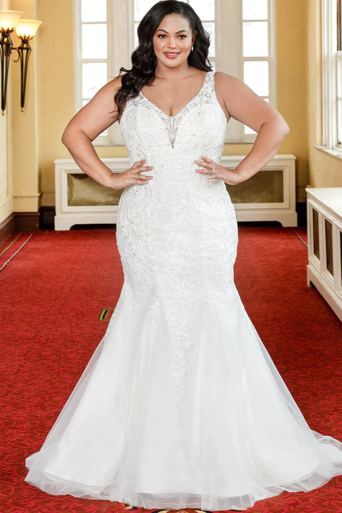 Michelle Bridal For Sydney's Closet MB2317 Fitted Silhouette Tulle Lace Embroidered Lace Appliques Seed Pearls Bugle Beads, Crystals Clear Sequins Satin Lining Deep V-Neck Plus Size "Netali" Bridal Gown. The "Netali" bridal gown from Michelle Bridal for Sydney's Closet MB2317 is designed to flatter any figure. It features a fitted silhouette made of tulle lace with embroidered lace appliques, seed pearls, bugle beads, and crystals clear sequins. The satin lining provides a comfortable fit