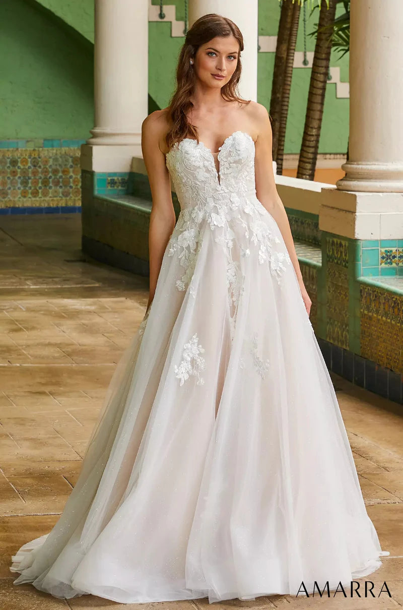 Amarra Bridal 84389 Madison A-Line Ballgown Sweetheart Neckline Strapless Floral Tulle Train Wedding Gown. This truly romantic wedding gown is perfect for the classic bride who wants to keep things traditional, but add her own elegant twist. Madison does just that, featuring a delicate V-neckline and floral lace appliques throughout the bodice, cascading down to a wide, billowy skirt. 