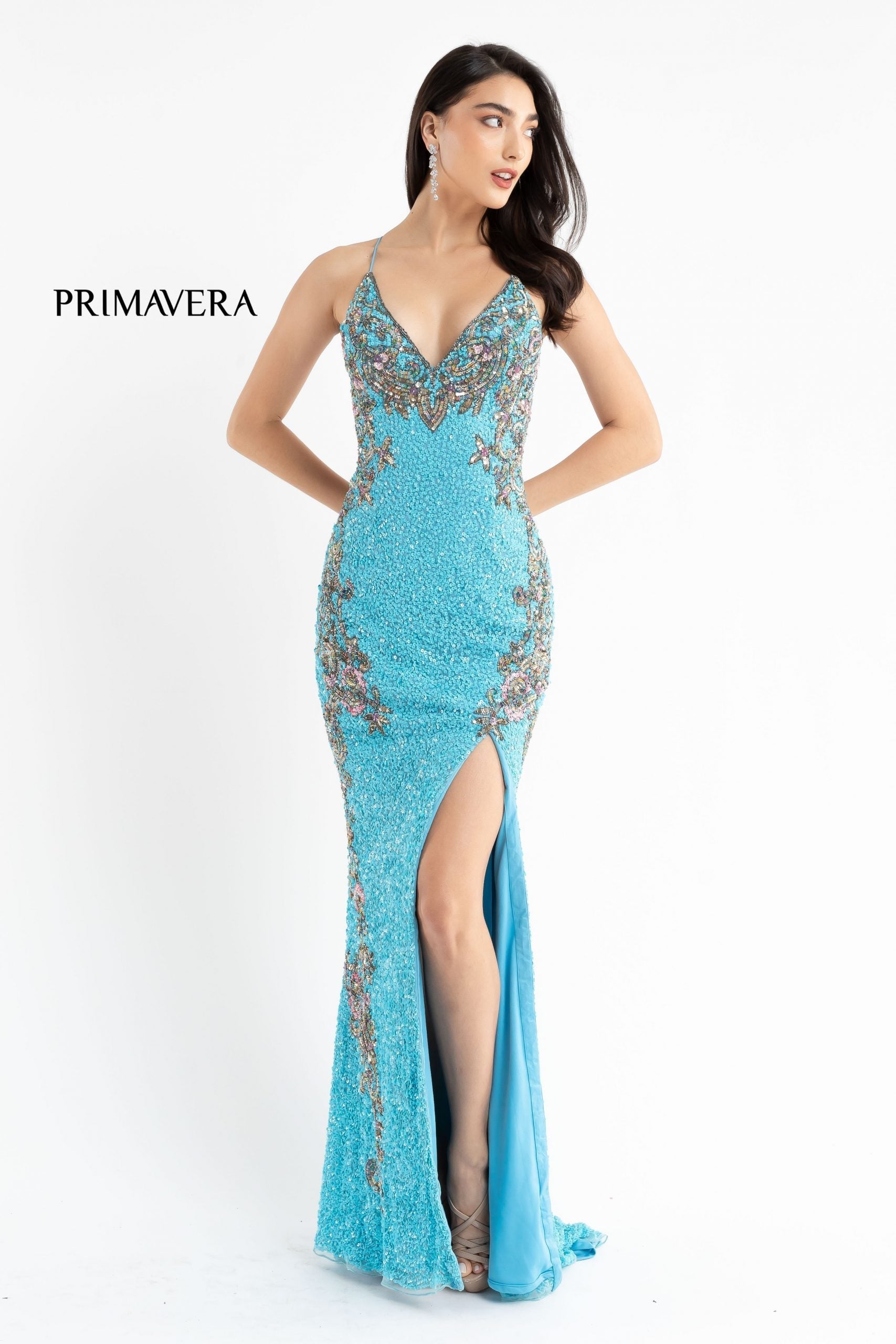 Primavera Couture 3211 is a Long fitted sequin Embellished Formal Evening Gown. This Prom Dress Features a deep V Neck with an open Corset lace up back. Beaded & embellished elegant scroll pattern accentuate curves. Fully beaded prom dress with floral pattern and side slit. Long Sequin Gown featuring a v neckline. slit in the fitted skirt, Slit in Thigh. Stunning Pageant Dress, Prom Gown & More!