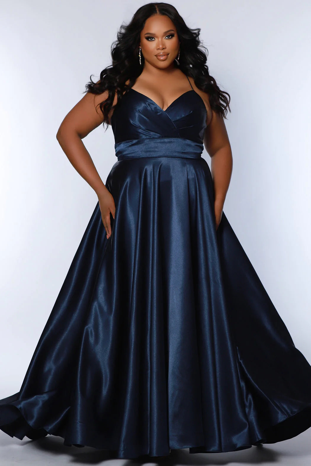 Sydney's Closet SC7355 A Line Satin Plus Size Prom Dress Slit V Neck Formal Gown Corset Color: Apricot, Lemon, Lime, Raspberry Size: 14-32 A-Line silhouette Spaghetti Straps Sweetheart neckline Lace-up back with modesty panel A-line skirt with slit Pockets Fully Lined