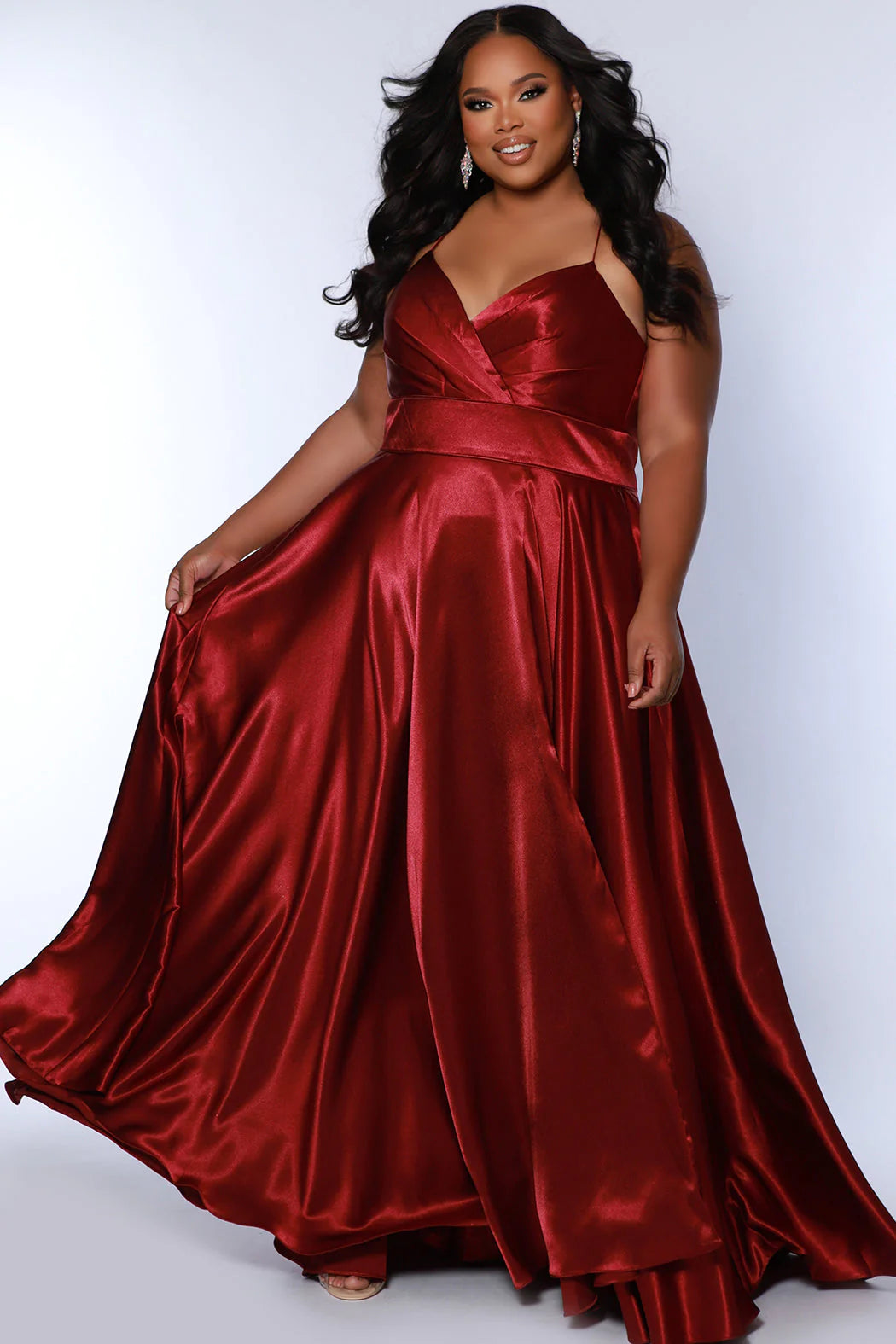 Sydney's Closet SC7355 A Line Satin Plus Size Prom Dress Slit V Neck Formal Gown Corset Color: Apricot, Lemon, Lime, Raspberry Size: 14-32 A-Line silhouette Spaghetti Straps Sweetheart neckline Lace-up back with modesty panel A-line skirt with slit Pockets Fully Lined