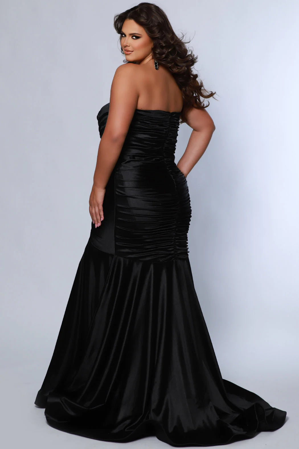 This elegant mermaid dress by Sydneys Closet SC7364 features a fitted sweetheart bodice top and a ruched satin skirt with a long, floor-length train. With a timeless strapless design, this prom dress is perfect for a formal occasion. Our curve-hugging long formal dress lets you look glamorous and make a trendy fashion statement at Prom or any elegant evening event coming up on your social calendar.