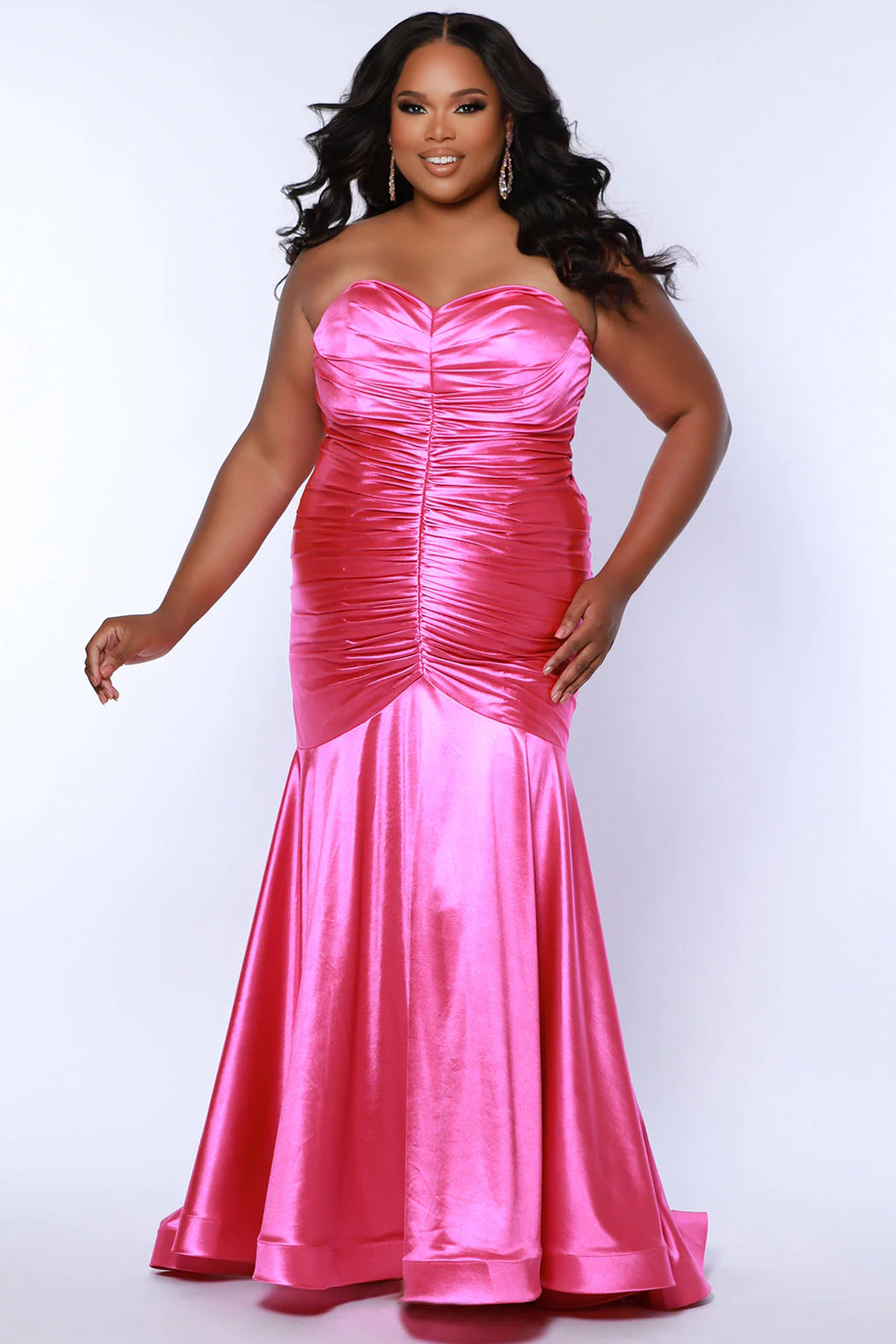 This elegant mermaid dress by Sydneys Closet SC7364 features a fitted sweetheart bodice top and a ruched satin skirt with a long, floor-length train. With a timeless strapless design, this prom dress is perfect for a formal occasion. Our curve-hugging long formal dress lets you look glamorous and make a trendy fashion statement at Prom or any elegant evening event coming up on your social calendar.