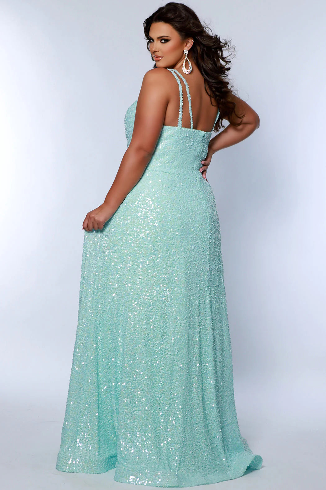 Be the belle of the ball in Sydneys Closet SC7365 Long Prom Dress. This plus size formal dress features an all-over sequin bodice with a scoop neckline, and a gathered A-line skirt with pockets. Perfect for prom nights, the elegant style of this gown will make you feel like a star.