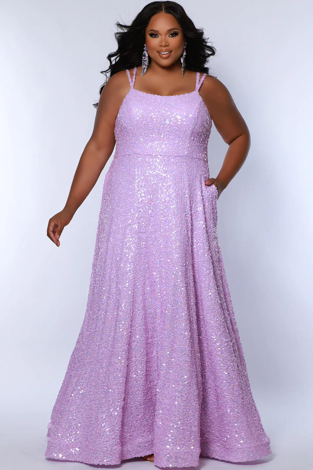 Be the belle of the ball in Sydneys Closet SC7365 Long Prom Dress. This plus size formal dress features an all-over sequin bodice with a scoop neckline, and a gathered A-line skirt with pockets. Perfect for prom nights, the elegant style of this gown will make you feel like a star.