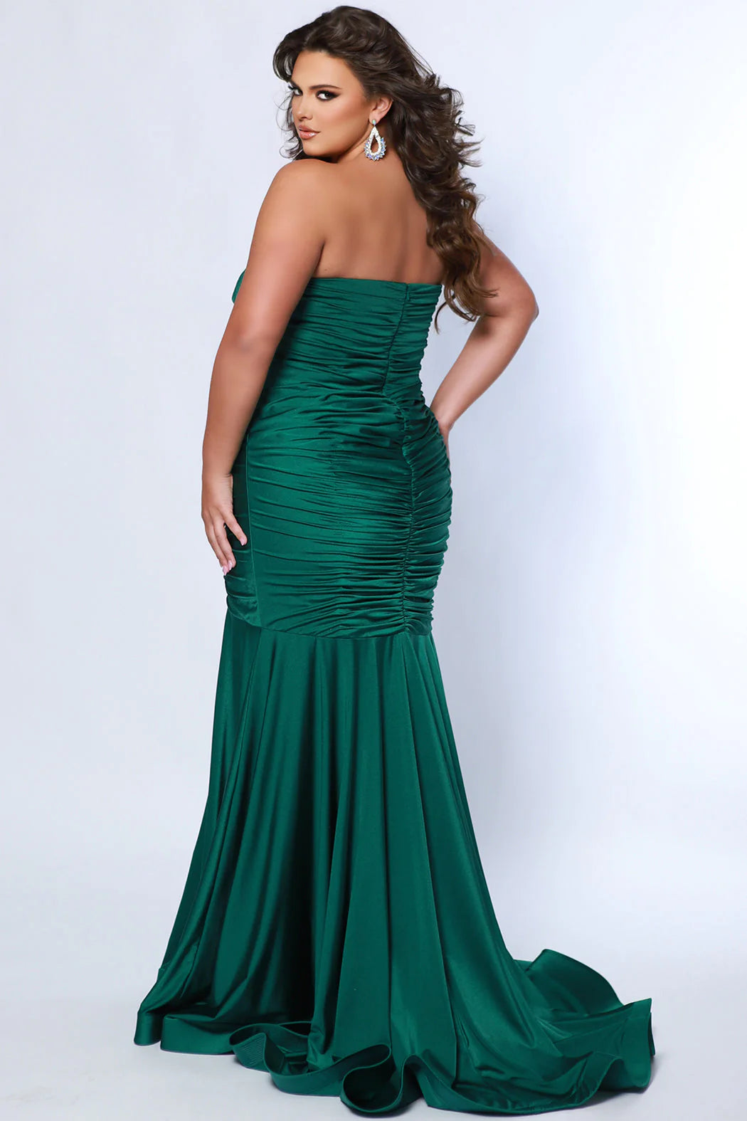 Make a statement in this luxurious Sydneys Closet SC7374 prom dress. This long, fitted gown is crafted in a mermaid silhouette, with a strapless neckline, ruching from the waistline to the floor, and a statement train. Perfect for plus size formal occasions. Look glamorous at Prom 2024 or any dressy event when you wear our Simply Ravishing plus size formal Mermaid gown. 