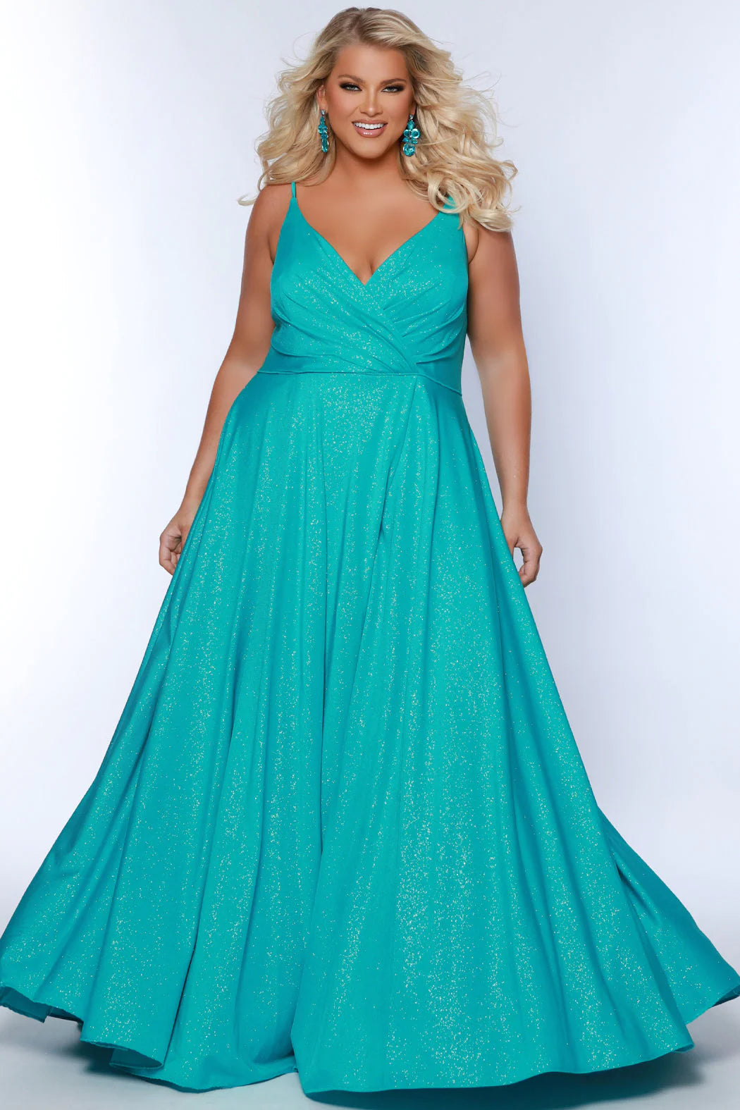 Look your best in our Sydney's Closet SC7375 Long Prom Dress - a beautiful A-line plus-size with a shimmering look an alluring maxi slit, and a formal gown silhouette that is perfect for any special event. The dress offers a flattering fit for all body types. All eyes are on you when you sparkle in this fabulous formal gown designed for women with real curves.