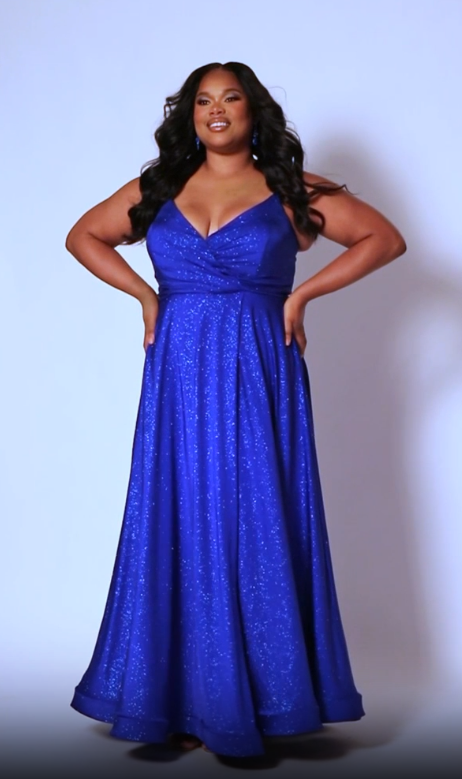 Look your best in our Sydney's Closet SC7375 Long Prom Dress - a beautiful A-line plus-size with a shimmering look an alluring maxi slit, and a formal gown silhouette that is perfect for any special event. The dress offers a flattering fit for all body types. All eyes are on you when you sparkle in this fabulous formal gown designed for women with real curves.