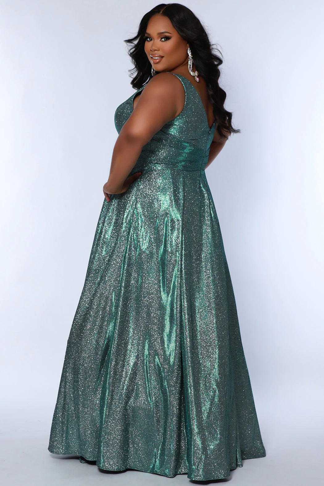 The Sydneys Closet SC7378 Long Prom Dress is perfect for plus size women who want to make a statement. With its V-neckline, A-line silhouette, and two side pockets, this formal gown is sure to turn heads. Crafted from high-quality materials for a comfortable fit, this dress is ideal for special events like proms and pageants. Look no further than our Secret Treasure plus size evening gown to look glamorous at Prom 2024 or the next formal occasion coming up on your calendar.  