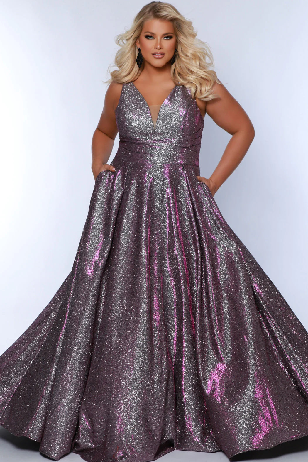 The Sydneys Closet SC7378 Long Prom Dress is perfect for plus size women who want to make a statement. With its V-neckline, A-line silhouette, and two side pockets, this formal gown is sure to turn heads. Crafted from high-quality materials for a comfortable fit, this dress is ideal for special events like proms and pageants. Look no further than our Secret Treasure plus size evening gown to look glamorous at Prom 2024 or the next formal occasion coming up on your calendar.  