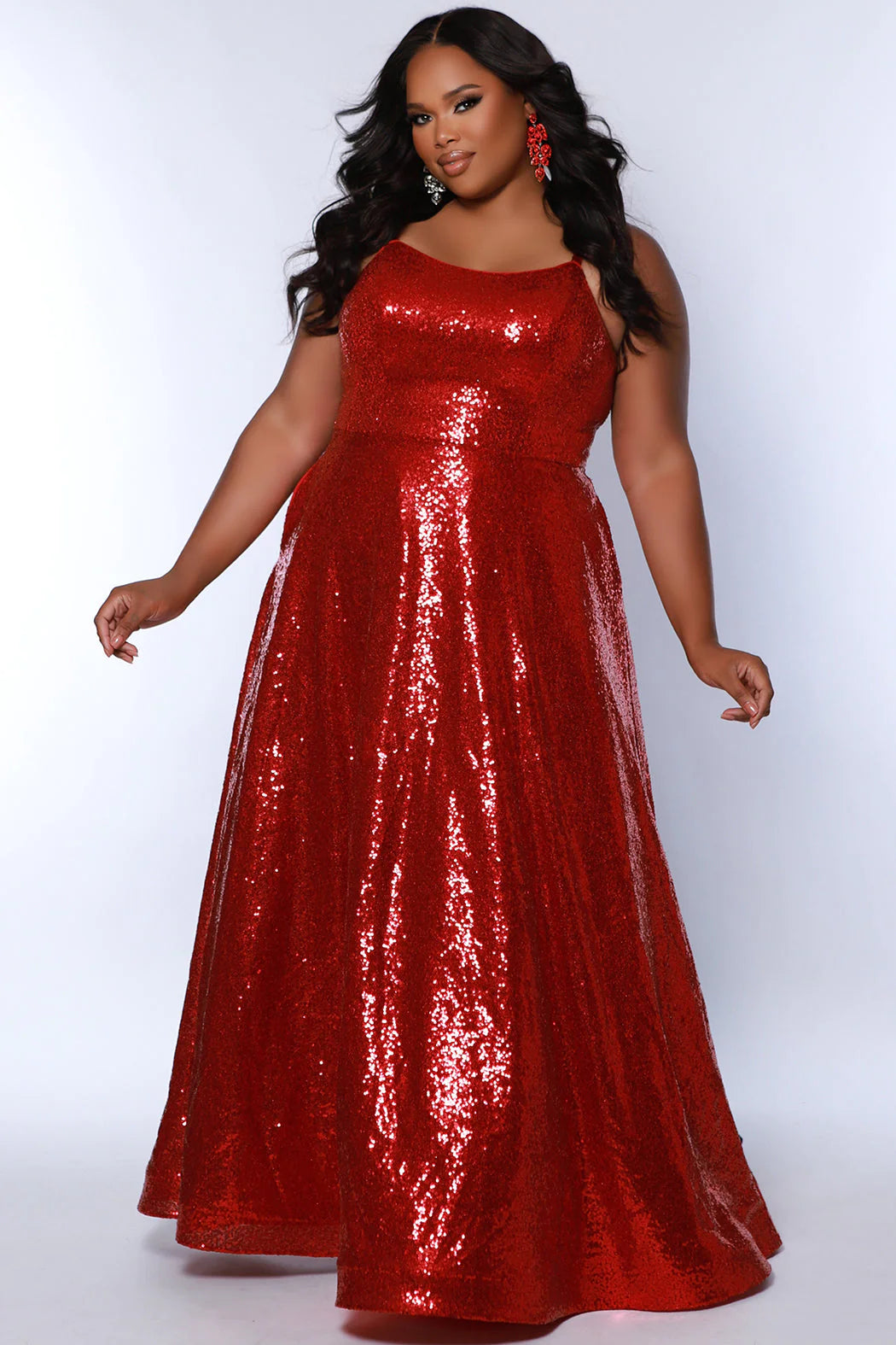 Make a statement in the Sydneys Closet SC7387 Plus Size Sequin A-Line Prom Dress. This beautiful formal gown features beaded sequin detailing, a flattering scoop neckline, and an elegant A-line silhouette. Perfect for prom, pageants, and other special occasions. Sparkle all night long when you wear this long evening gown to Prom or any other formal event on your social calendar that calls for the glamour of overall sequins.