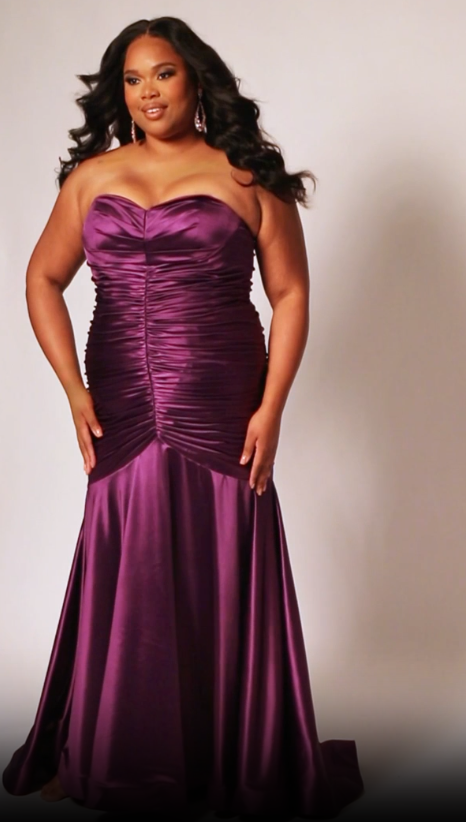 This elegant mermaid dress by Sydneys Closet SC7364 features a fitted sweetheart bodice top and a ruched satin skirt with a long, floor-length train. With a timeless strapless design, this prom dress is perfect for a formal occasion. Our curve-hugging long formal dress lets you look glamorous and make a trendy fashion statement at Prom or any elegant evening event coming up on your social calendar.