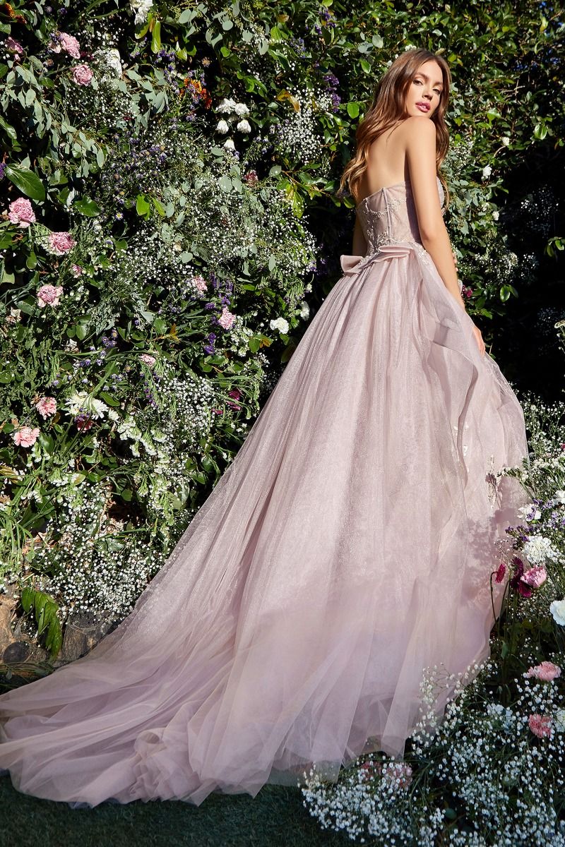 Experience couture luxury in Andrea & Leo Couture's A1021 Sheer Layered Ballgown. Combining a corset bodice with a sheer layered skirt, this fairytale gown is the ideal formal dress for any special occasion. Sophisticated and elegant, the gown is made of quality materials and comes in a variety of sizes. Look no further than this breath-taking strapless layered tulle ball gown! 