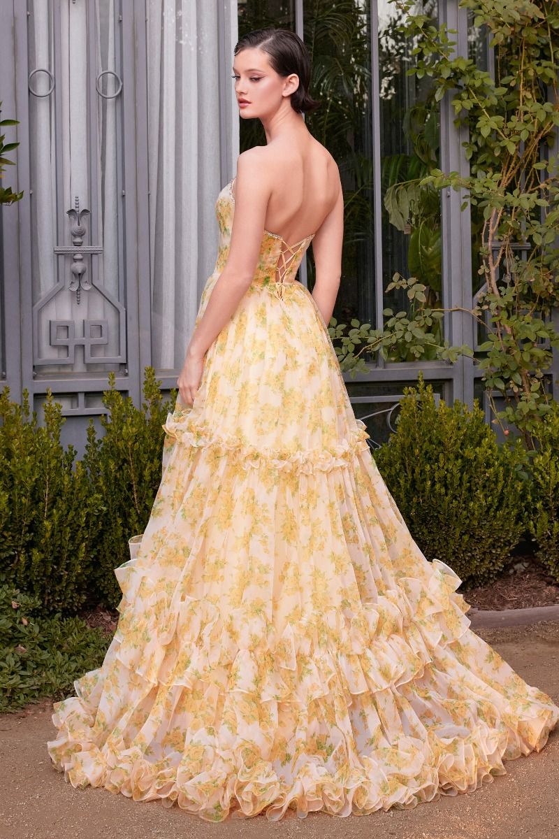 Experience the ultimate in elegance with our Andrea &amp; Leo Couture A1430 dress. The A-line shape flatters any figure, while puff sleeves and a slit add a modern touch. The pleated layer and ballgown design make this dress perfect for any formal occasion. Command attention and turn heads in this stunning yellow ruffle dress. Turn heads in this enchanting yellow floral printed organza ball gown, perfect for prom or formal occasions. Featuring a strapless deep V-neckline and an intricately embellished edged