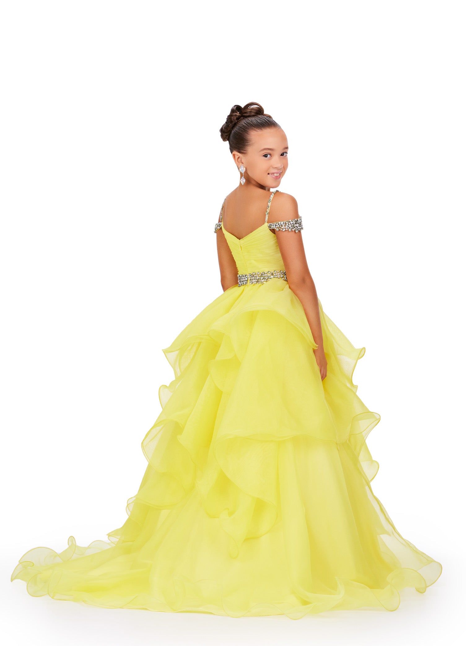 Glam up your little one's pageant look with the Ashley Lauren Kids 8250 A Line Ruffle Dress. This stunning ballgown features a delicate off-the-shoulder neckline, adorned with intricate beading. The ruffled A-line skirt adds a touch of elegance, making your child shine on stage. Perfect for any formal occasion. 