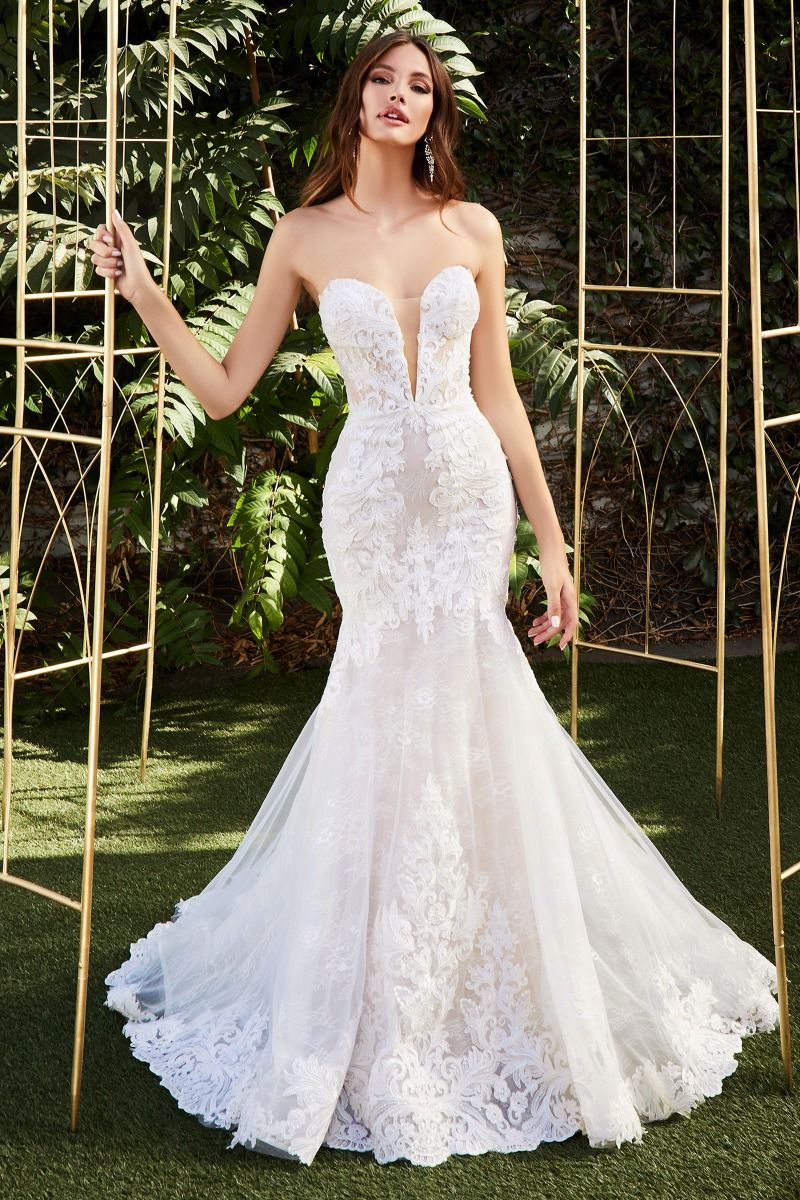 Look like a dream in the Ladivine CD928 long lace mermaid wedding dress. Featuring a stunning lacework that cinches the waist, corset bodice, and scallops at the hem, this gown creates an hourglass silhouette that is perfect for the special bride. The removable back tail allows for an elegant look during the ceremony and a more relaxed look for the reception. Make your wedding day extra special with the Ladivine CD928.