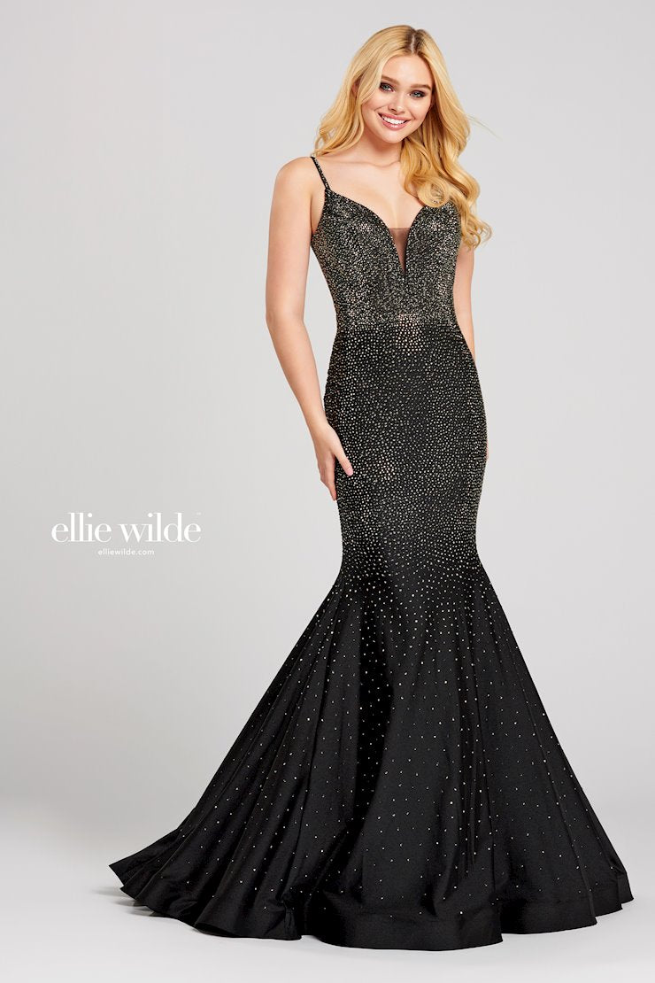 Look stunning in this Ellie Wilde EW120012 prom dress. This gorgeous mermaid-style gown has a backless crystal jersey design and sparkling crystal appliqué detailing that will make you shine on the dance floor. The fitted jersey fabric ensures that you’ll look your best in this dazzling gown. Sleeveless novelty stretch fit and flare gown with a plunging V-neck, natural waist, stone accents throughout gown, open bandeau back, horsehair hem and a sweep train.