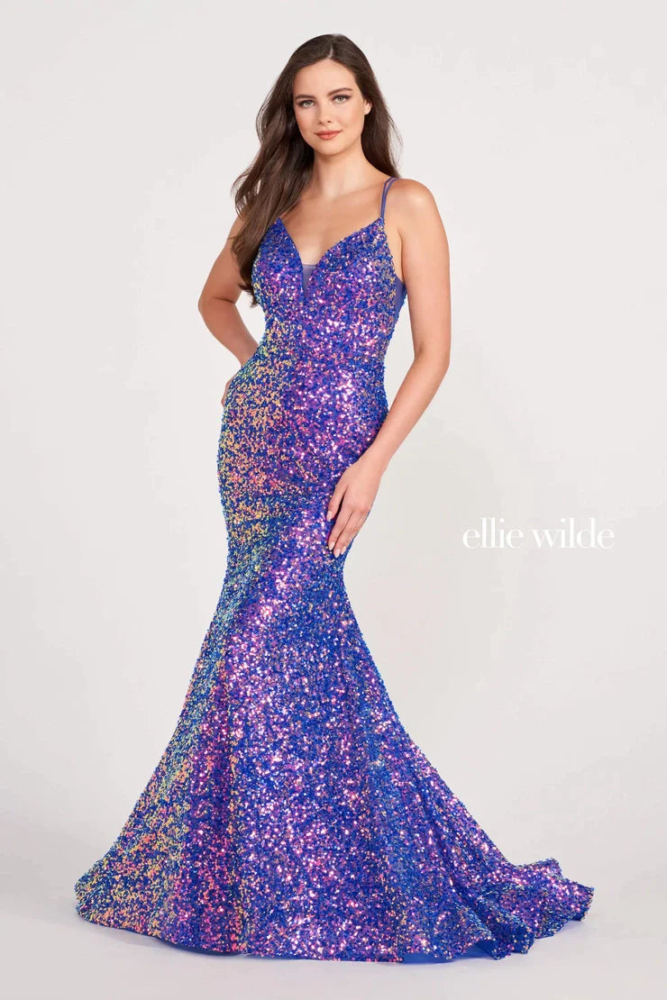 Look sophisticated and graceful in Ellie Wilde EW34016. The signature Iridescent color shifting sequins and mermaid silhouette make this timeless corset dress a perfect choice for a formal occasion. Captivate everyone in the room with its sparkling iridescent material and backless v-neckline.  Sizes: 00-20  Colors: ORANGE, LIGHT BLUE, HOT PINK, IRIS, FOREST LIGHT, PURPLE RAIN  https://dy9ihb9itgy3g.cloudfront.net/static/themes/EllieWilde/Spring_2023/EW34016.mp4