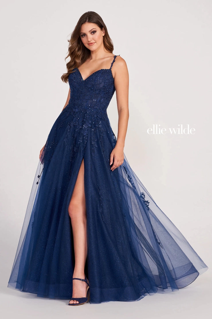 Discover a stunning combination of sheer lace shimmer and A-line silhouette with the Ellie Wilde EW34116 Prom Dress. Highlight your figure with a daring maxi slit, perfect for a formal event. This gown exudes elegance and sophistication, making you stand out amongst the crowd. Turn heads in this must-have dress.