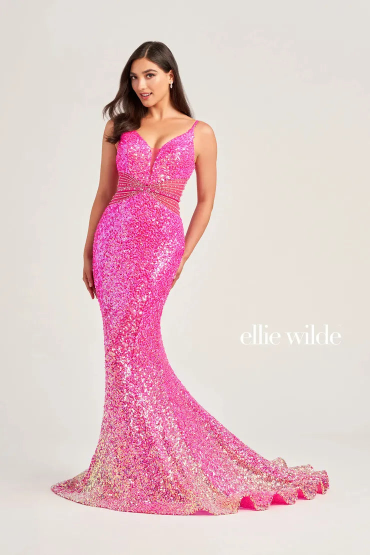 This Ellie Wilde Sequin Mermaid Sheer Prom Dress is perfect for your next special occasion. With its stunning beaded V neck and sheer detailing, this dress will make you stand out in the crowd. Its form-fitting silhouette and sparkling sequin design will make you feel confident and elegant. Ombre  Sizes: 00-16  Colors: OCEAN BLUE, HOT PINK