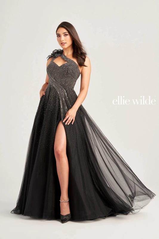 The Ellie Wilde EW35086 Dress boasts a stunning one shoulder cut out design adorned with intricate beading and a bow detail. Its ballgown silhouette, paired with a maxi slit, creates a dramatic and elegant look. Perfect for formal events, this dress is sure to make a lasting impression.  Sizes: 00-16  Colors: Misty Blue, Black/Gunmetal