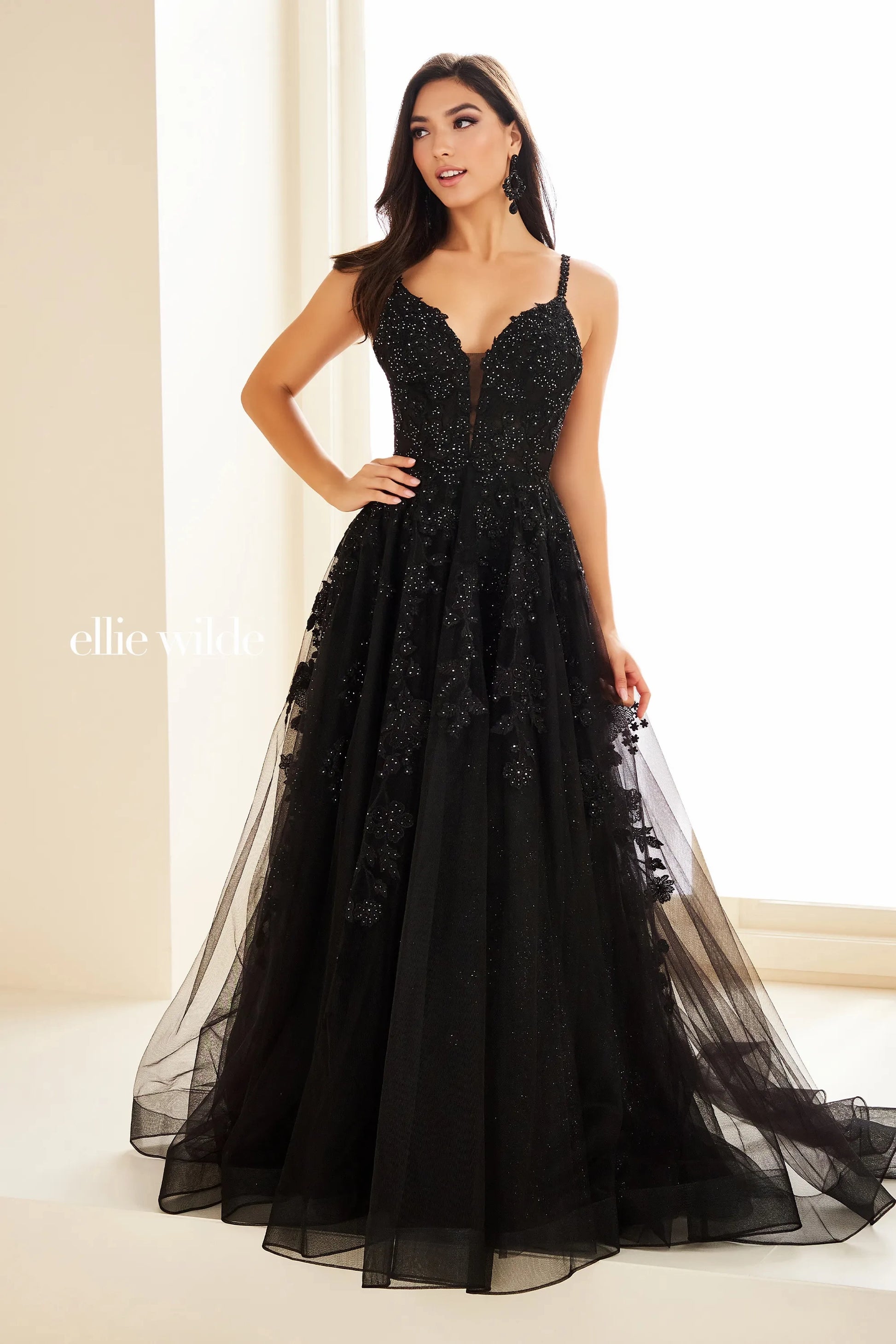 Be the star of the prom in the exquisite Ellie Wilde EW36015 Long Prom Dress. This stunning A-line gown features sheer lace and shimmering details, perfect for any formal occasion. With its beautiful design and comfortable fit, you'll feel confident and elegant all night long. Embrace your inner beauty and shine in this gorgeous ballgown.