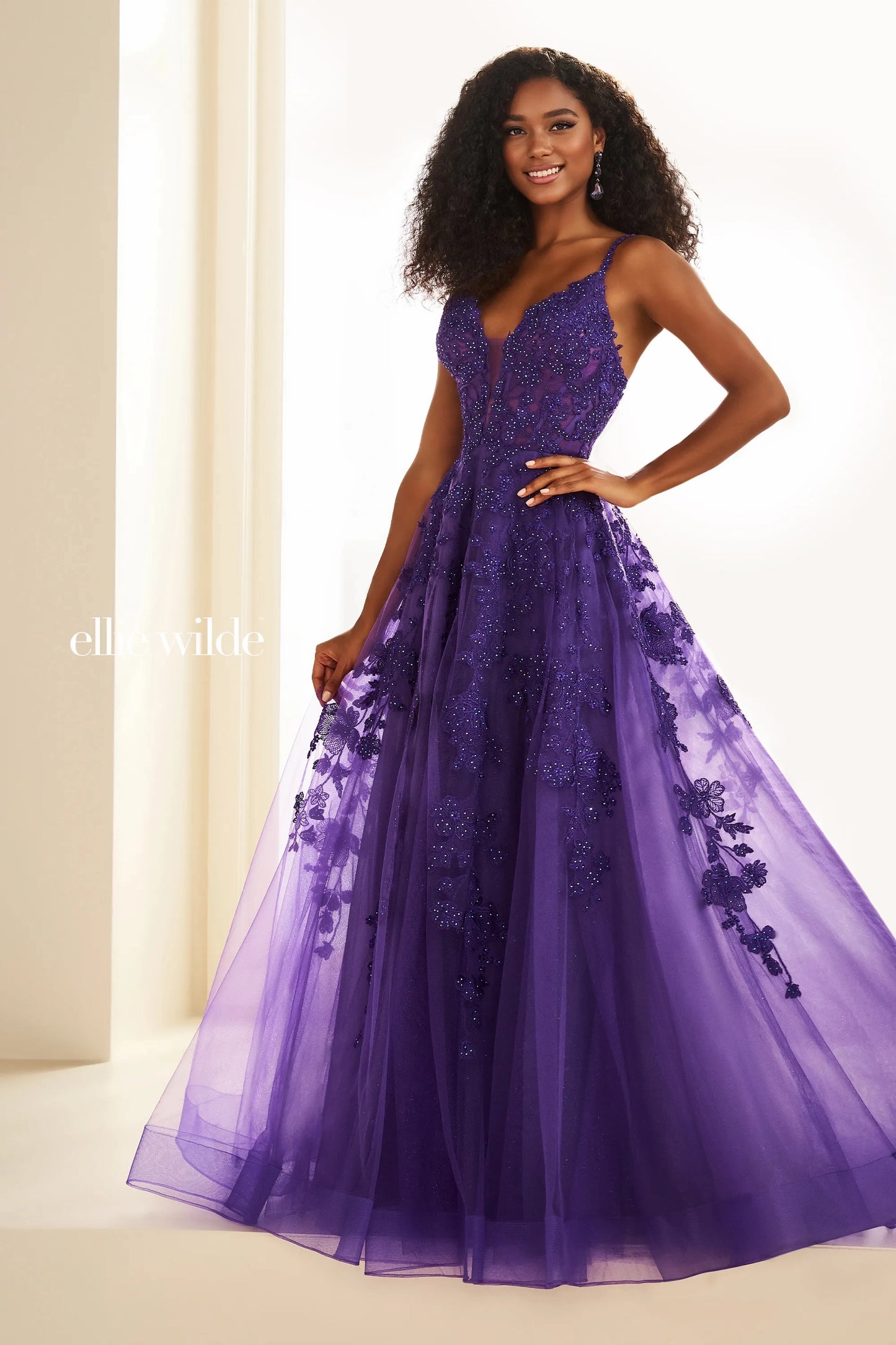 Be the star of the prom in the exquisite Ellie Wilde EW36015 Long Prom Dress. This stunning A-line gown features sheer lace and shimmering details, perfect for any formal occasion. With its beautiful design and comfortable fit, you'll feel confident and elegant all night long. Embrace your inner beauty and shine in this gorgeous ballgown.